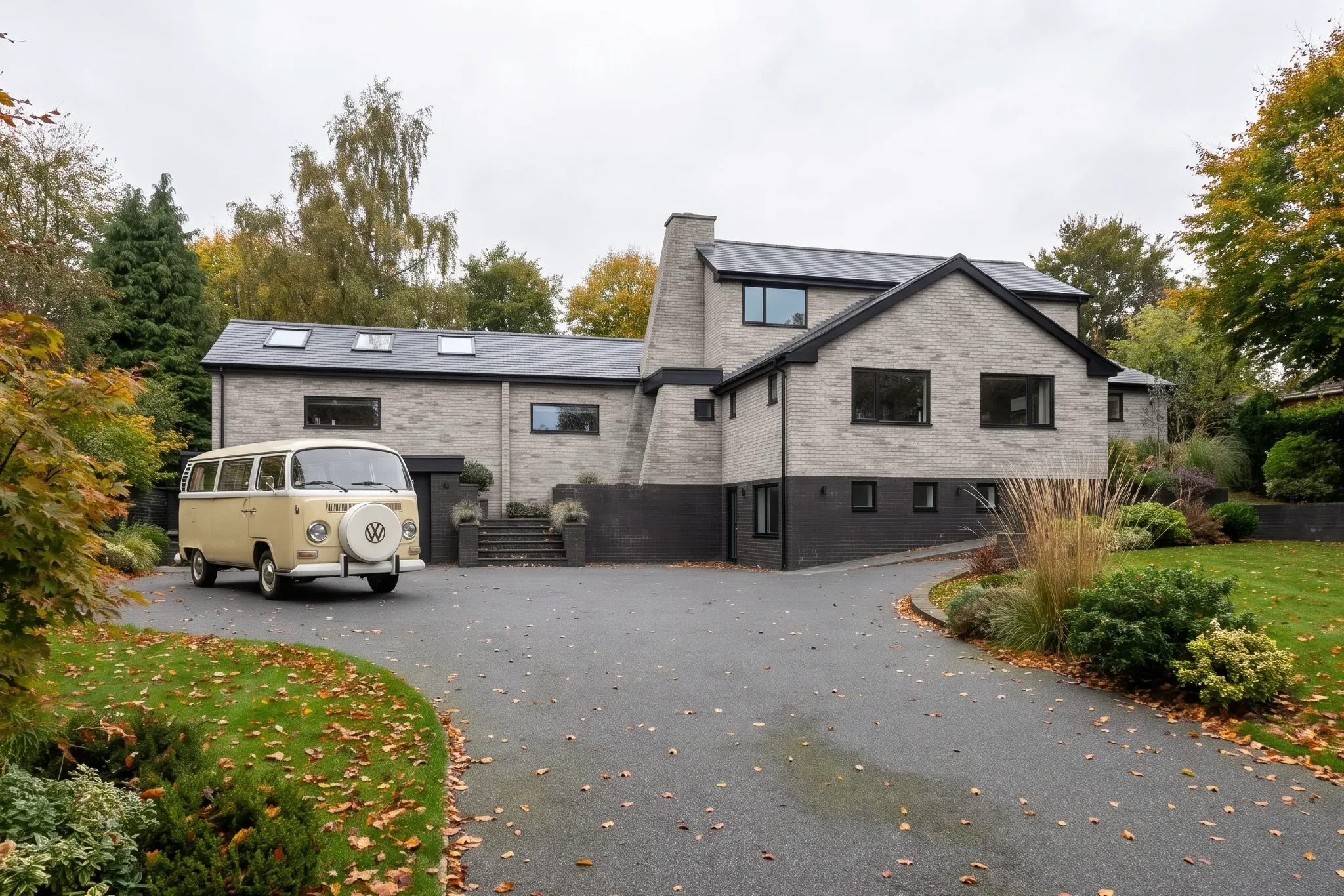 The remodelled entrance and driveway within their leafy setting