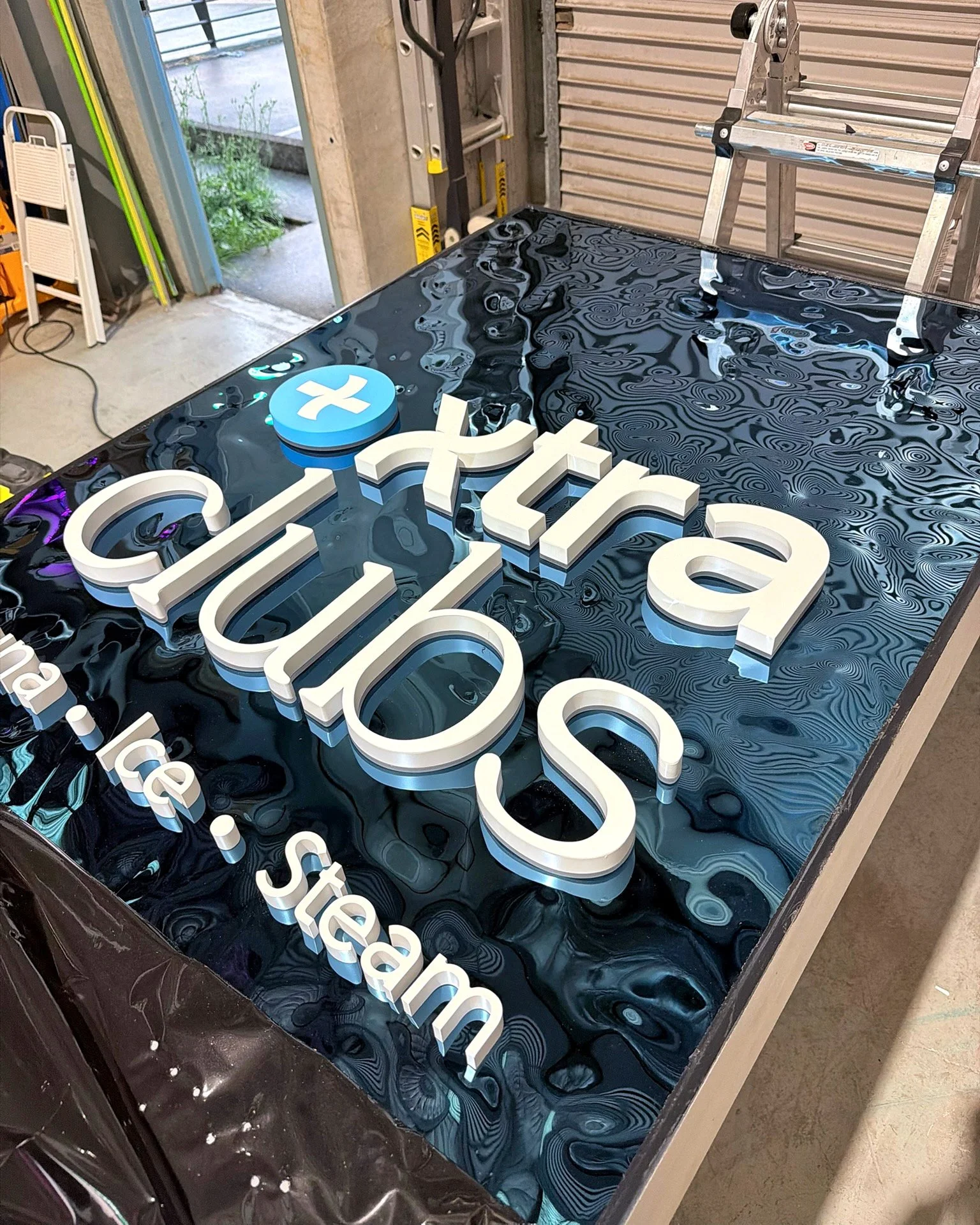 Finishing touches on another incredible fit-out with @dlbprojects ✨

Check out this custom ripple panel paired with LED acrylic lettering @xtraclubs 
A striking feature that adds depth, movement and glow to the space.

Designed to catch the light and