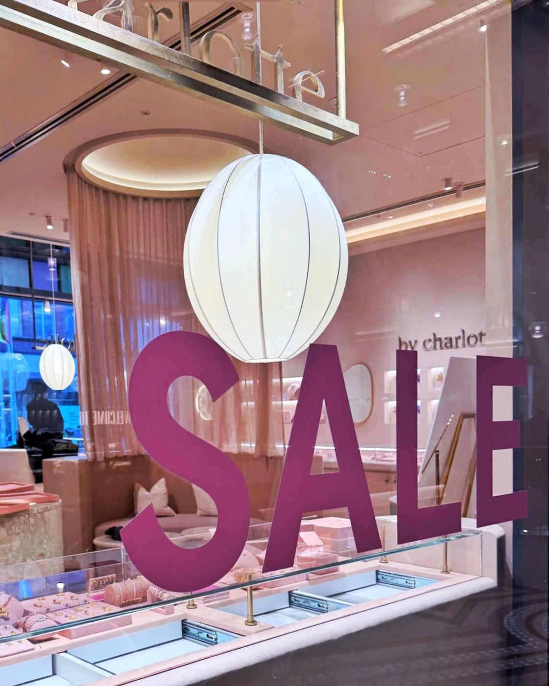 Window vinyl installed for the @bycharlotte_  June Sale. Bold, bright, and unmissable.
🌸✨💕
#tvisualconcepts #bycharlotte #windowgraphics #retailsignage #shopfrontsignage