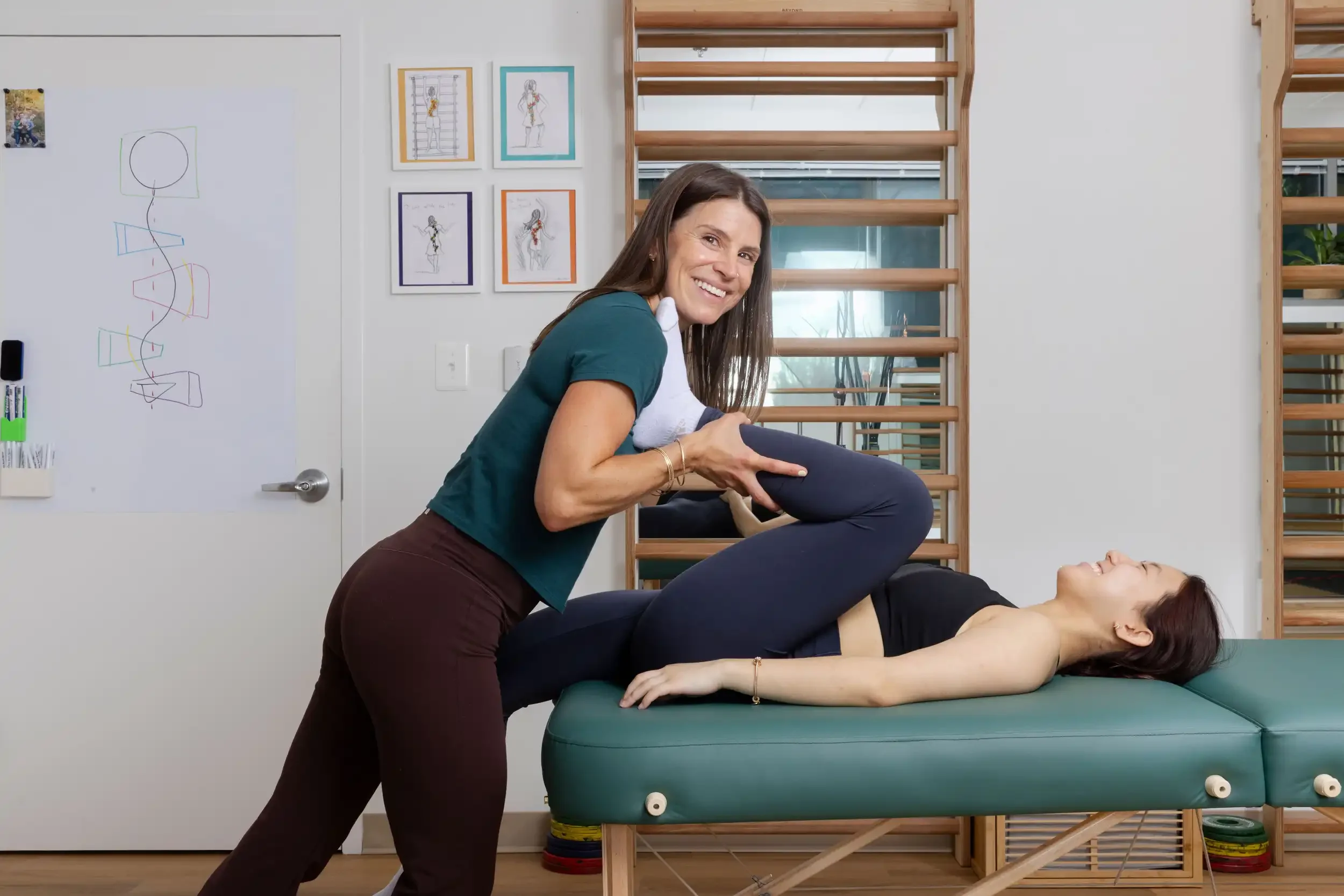 physical therapist doing manual therapy on adult patient