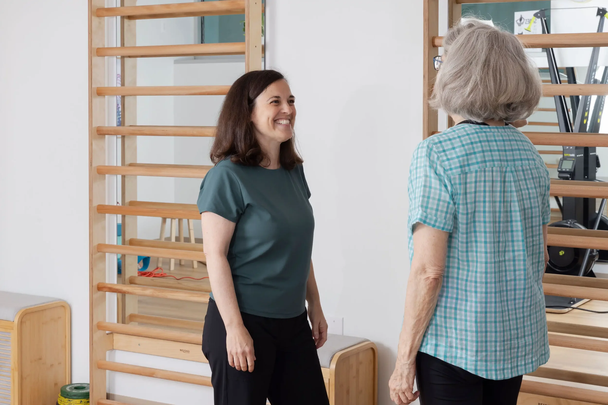 pelvic floor physical therapist talking with senior patient