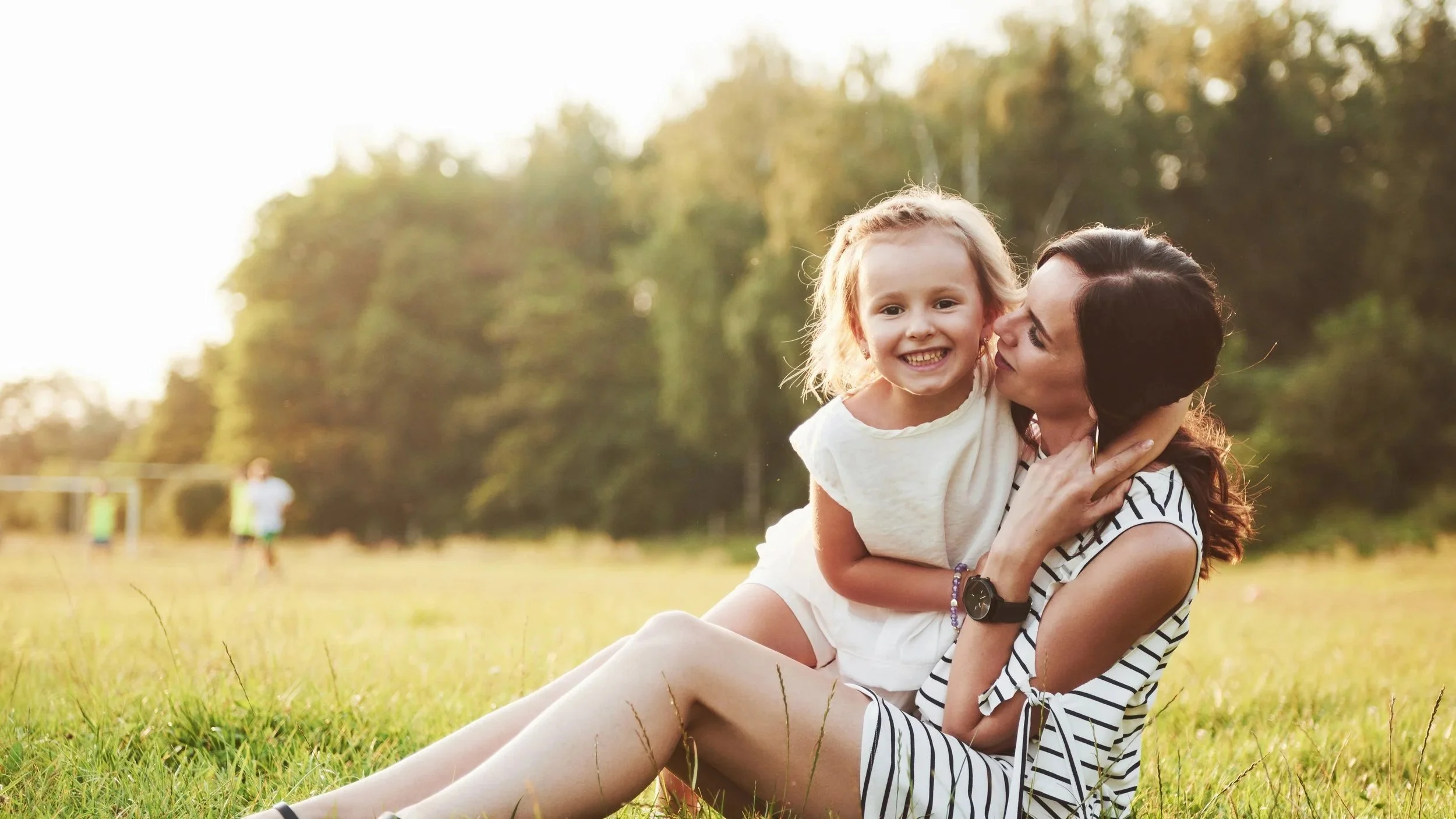 happy-mother-daughter-hugging-park-sun-bright-summer-herbs.jpg