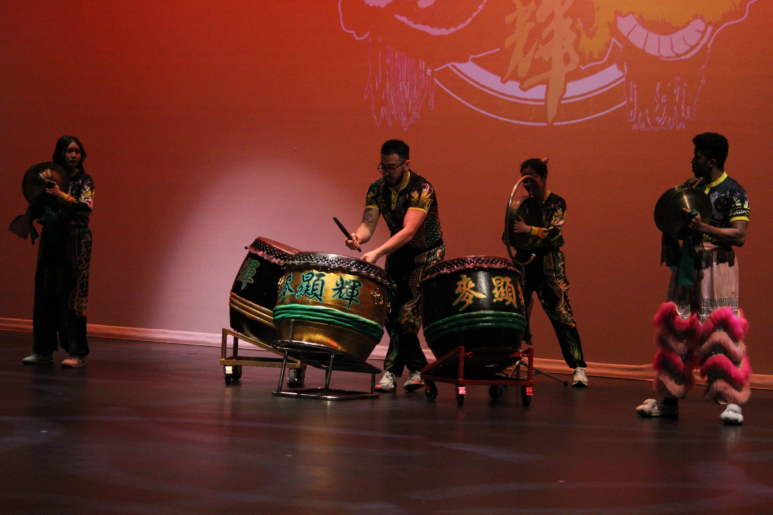 MakFai performers playing cymbals and drums on stage at Lunar New Year Edmonds.