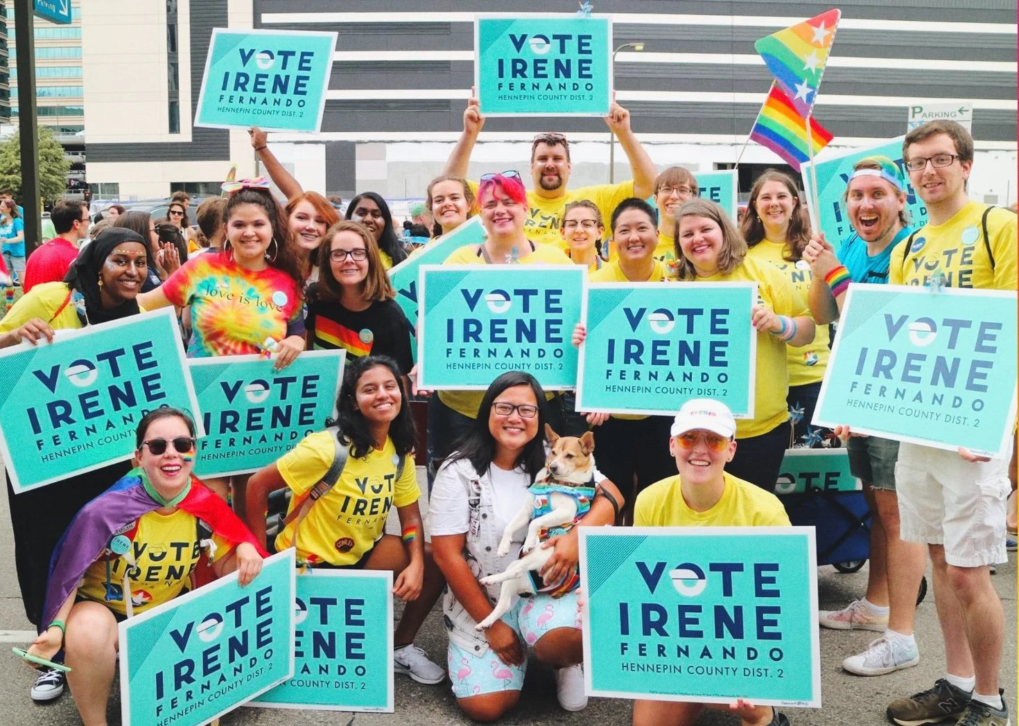 Irene Fernando and campaign volunteers holding Vote Irene Fernando signs at the Twin Cities Pride parade