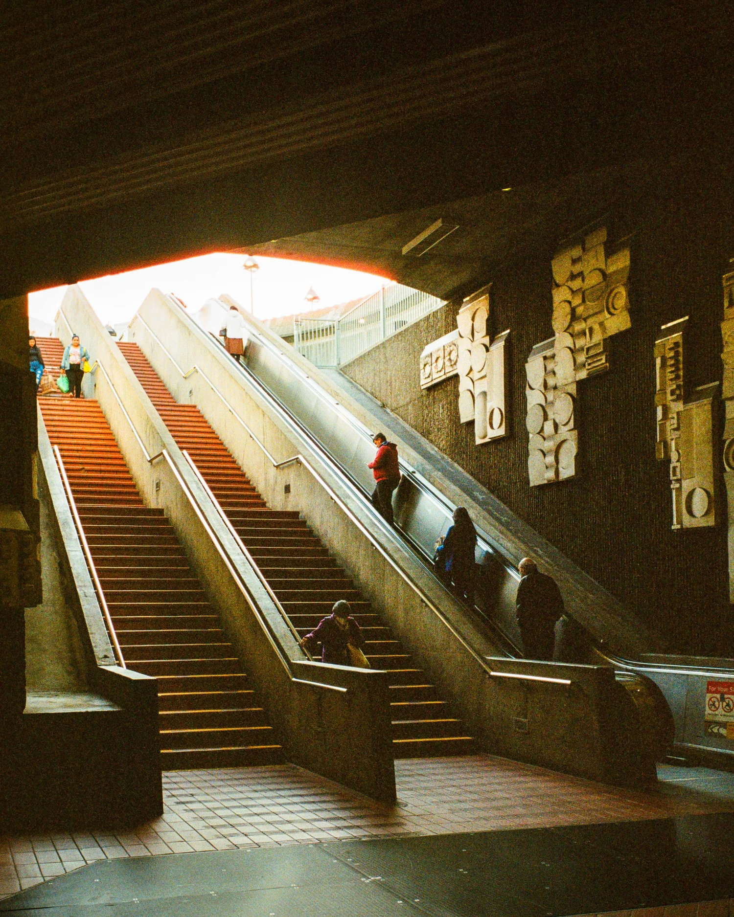 Escalators and tiled stairs inside a San Francisco BART station