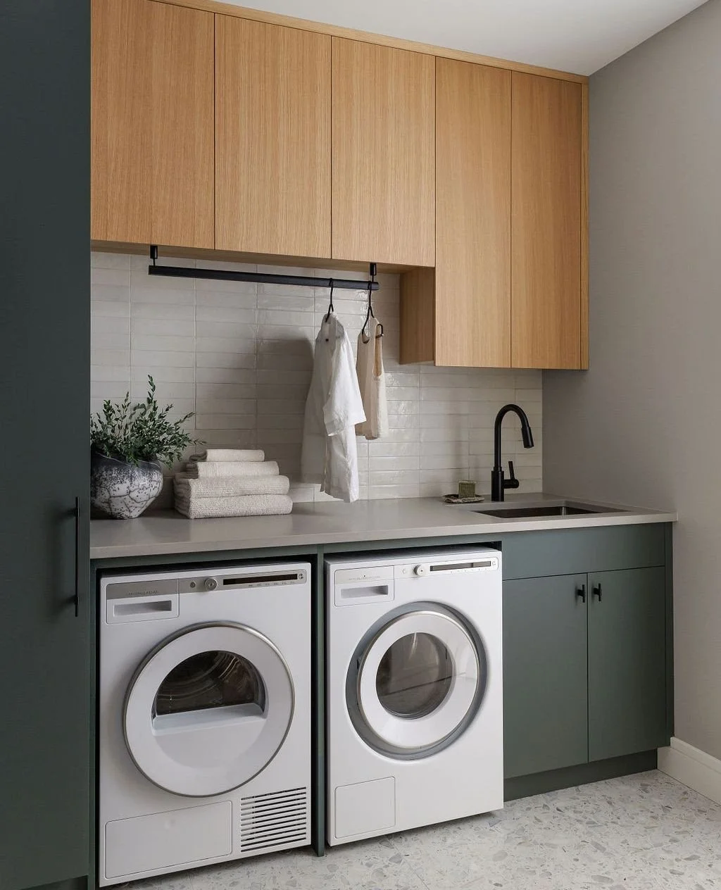 Want to know one of the most functional and hardest working rooms in the Vancouver Island Residence?  The combined laundry and mud room. ⁠
⁠
Located between the garage entrance and the main house we combined the two separate functions on either side 