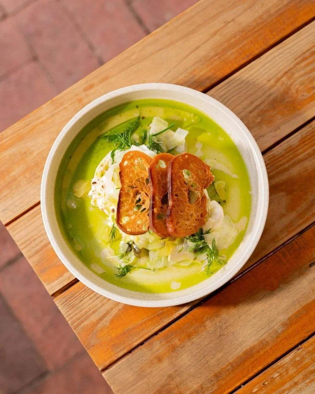 Fish in a green herb broth