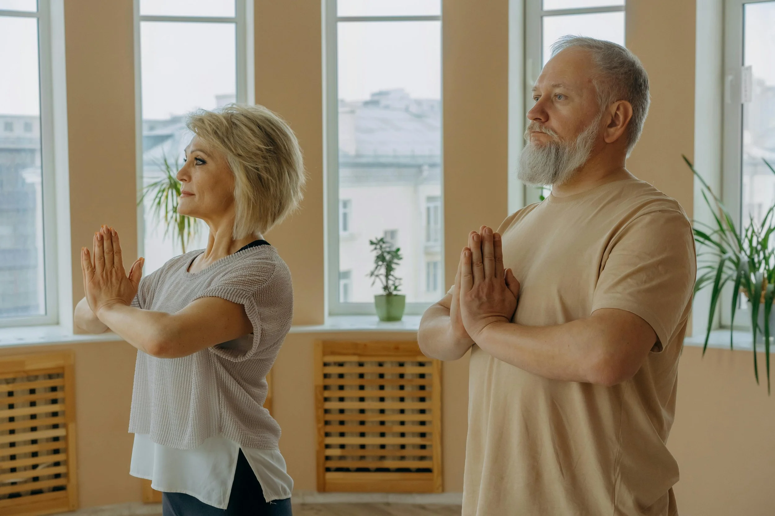 A Man and a Woman Doing the Prayer Pose