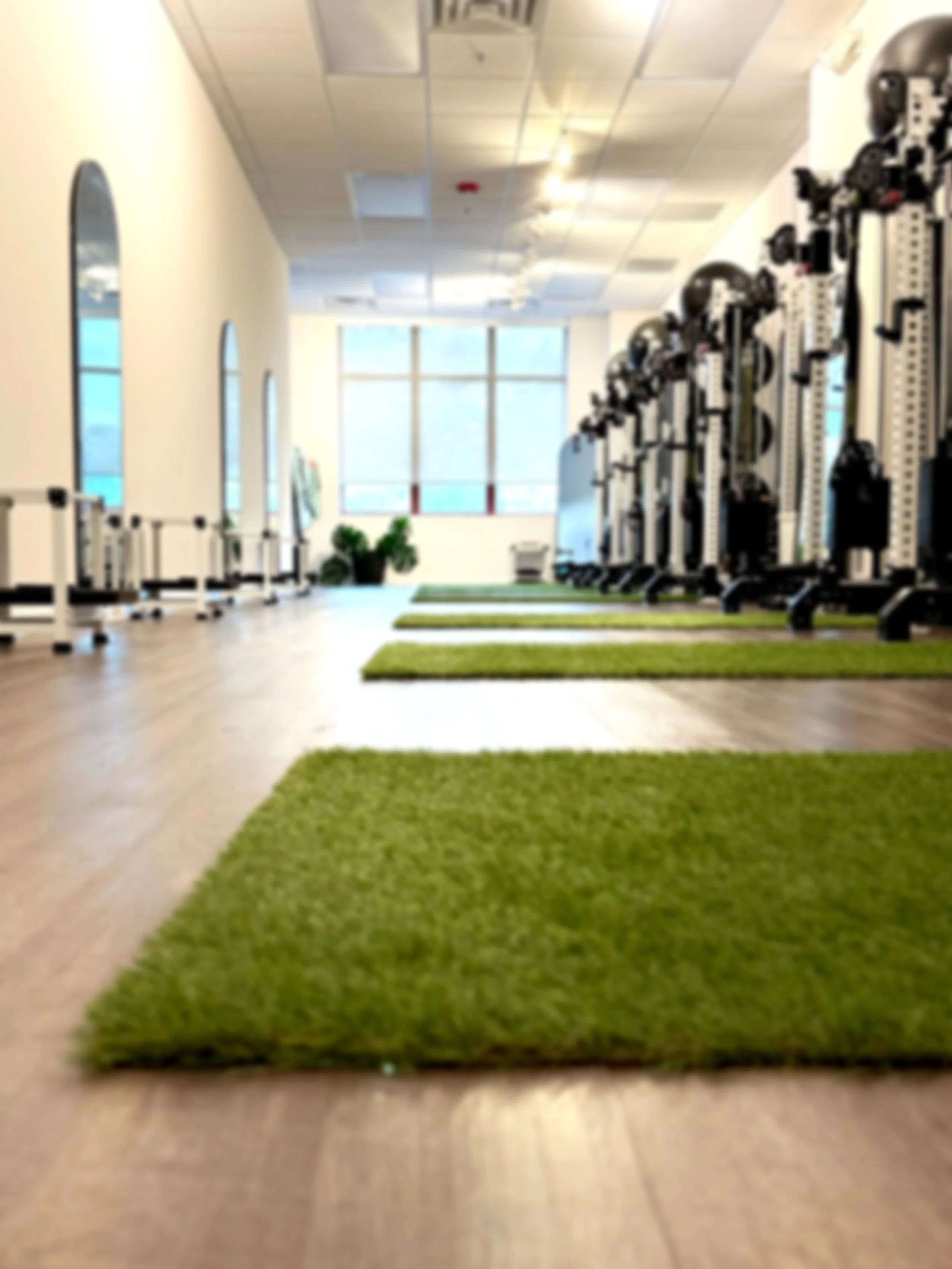 Silhouette of a person singing or speaking with a microphone, in front of a large applause sign.