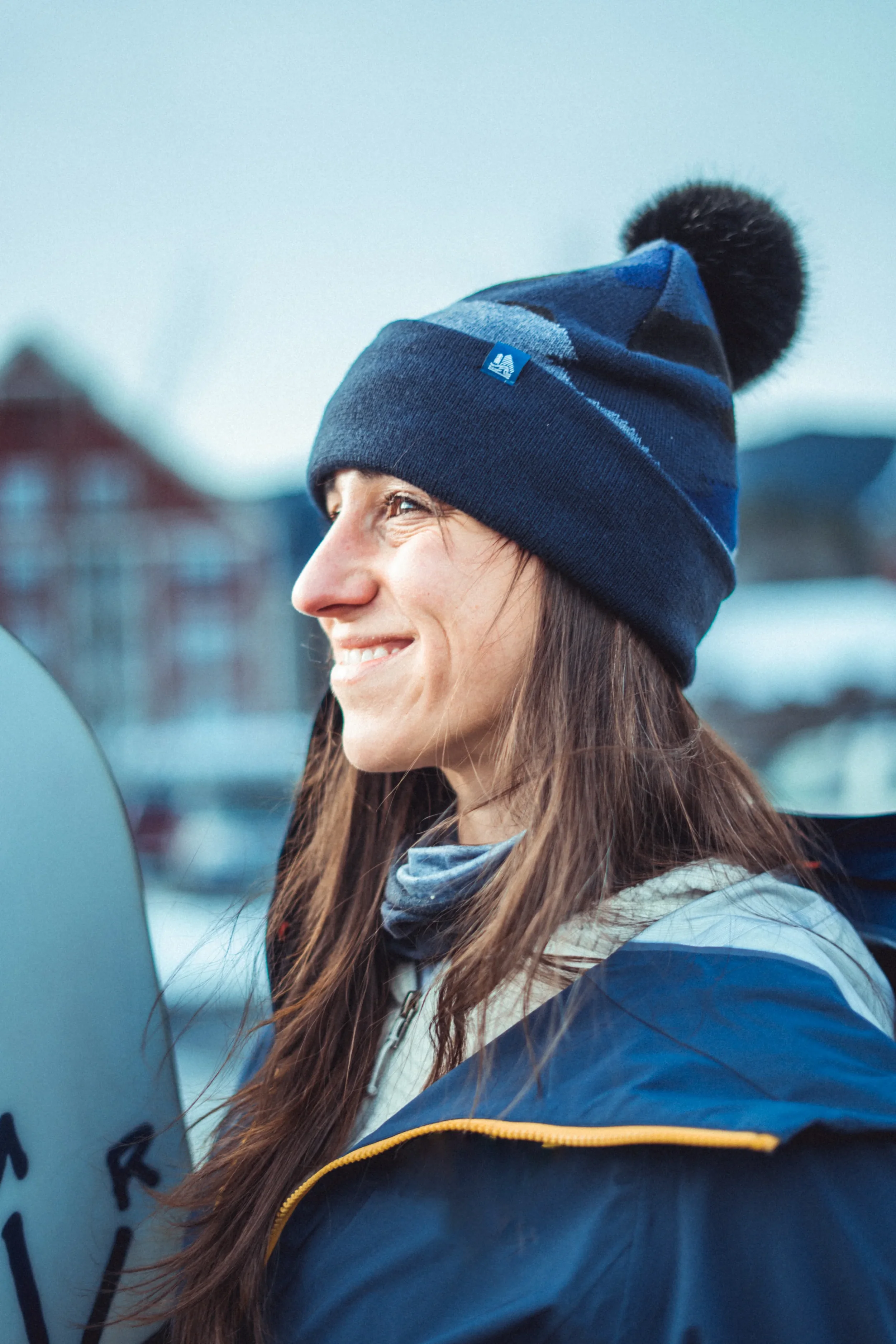 woman wearing a 4t2d cuffed pom beanie