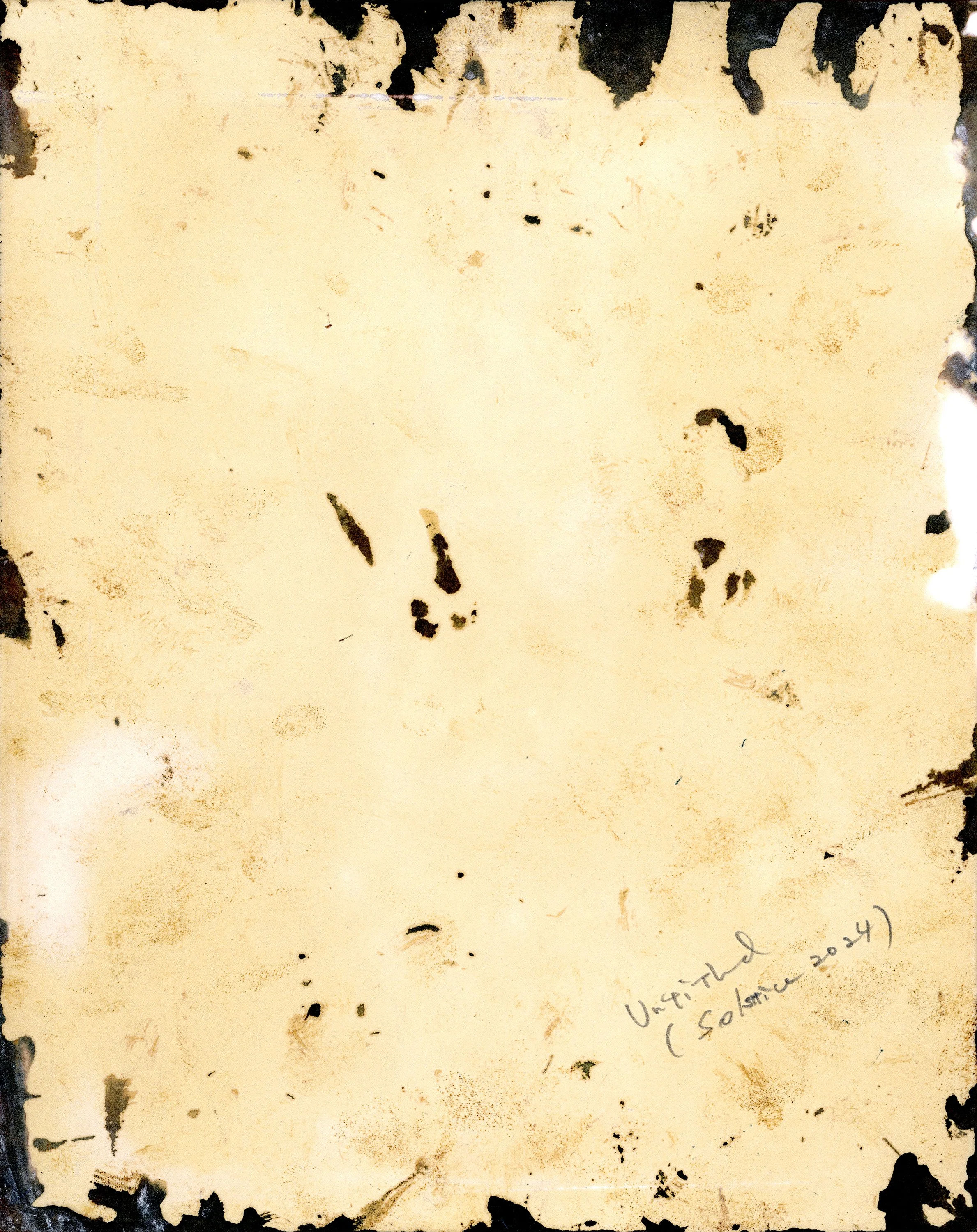 The original unfixed print, reverse side, one year later.