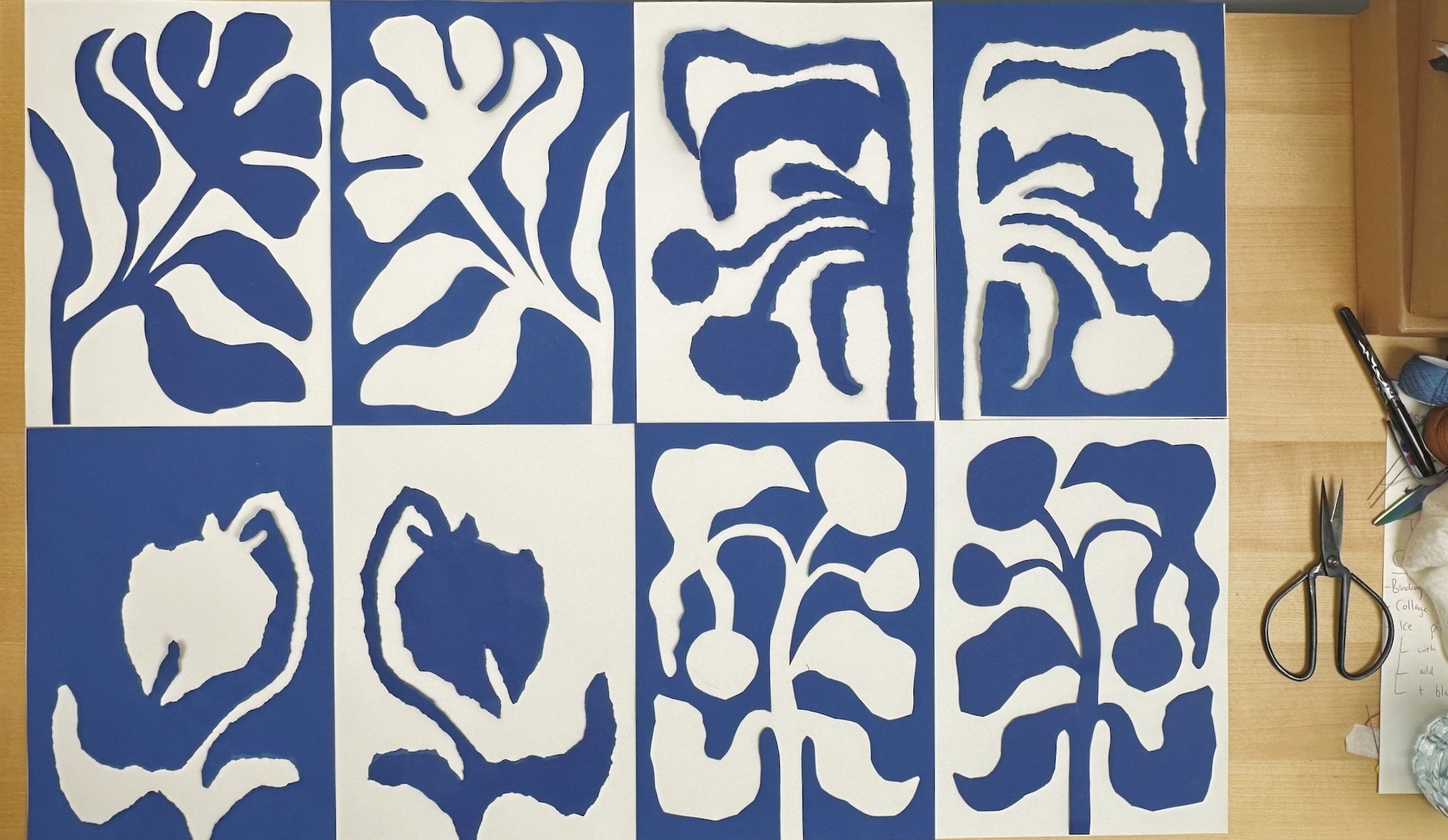 Blue and off white positive and negative paper collages by Rebekah Johnston
