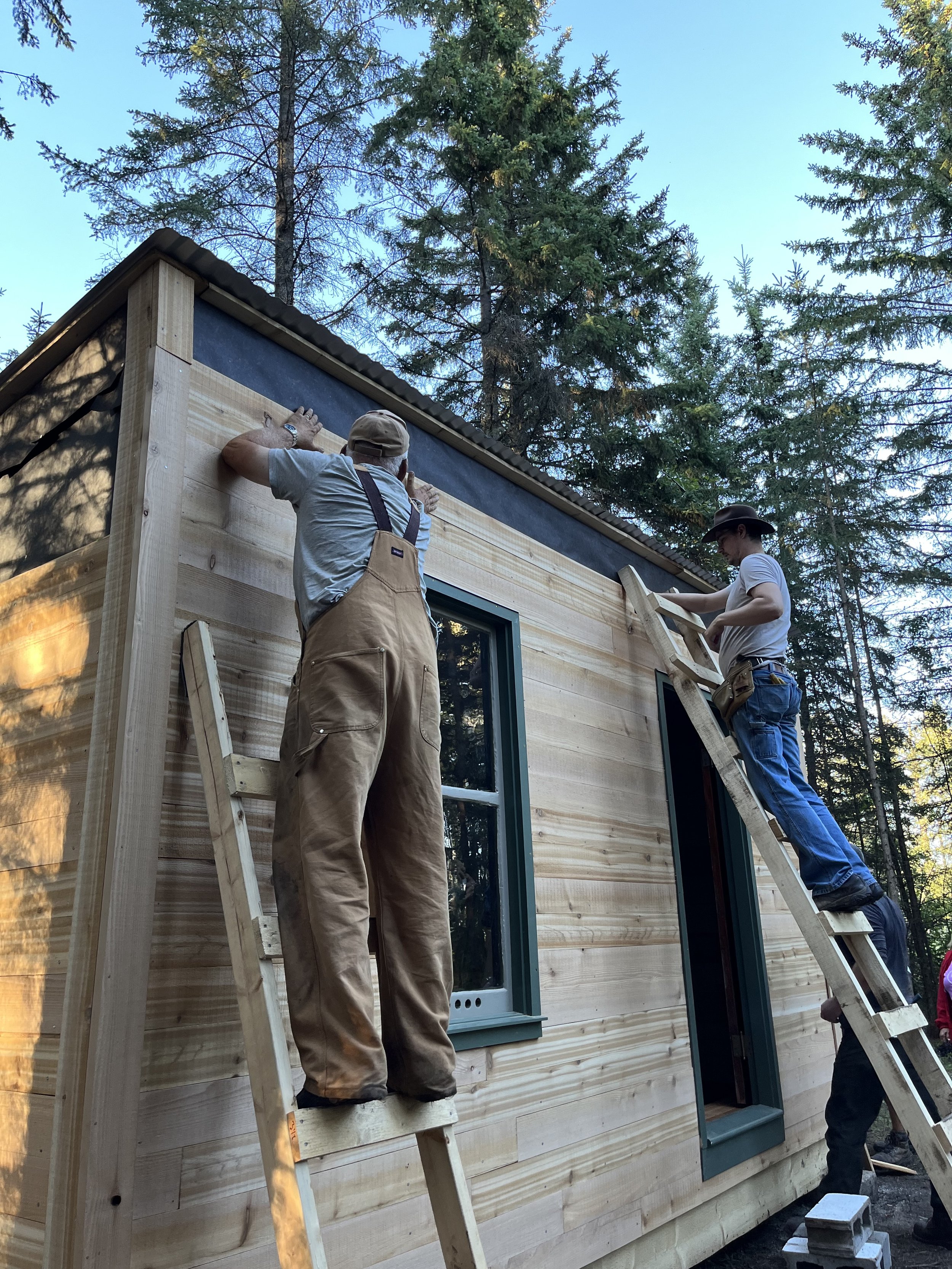 Keith and Tristin working on the siding.jpeg