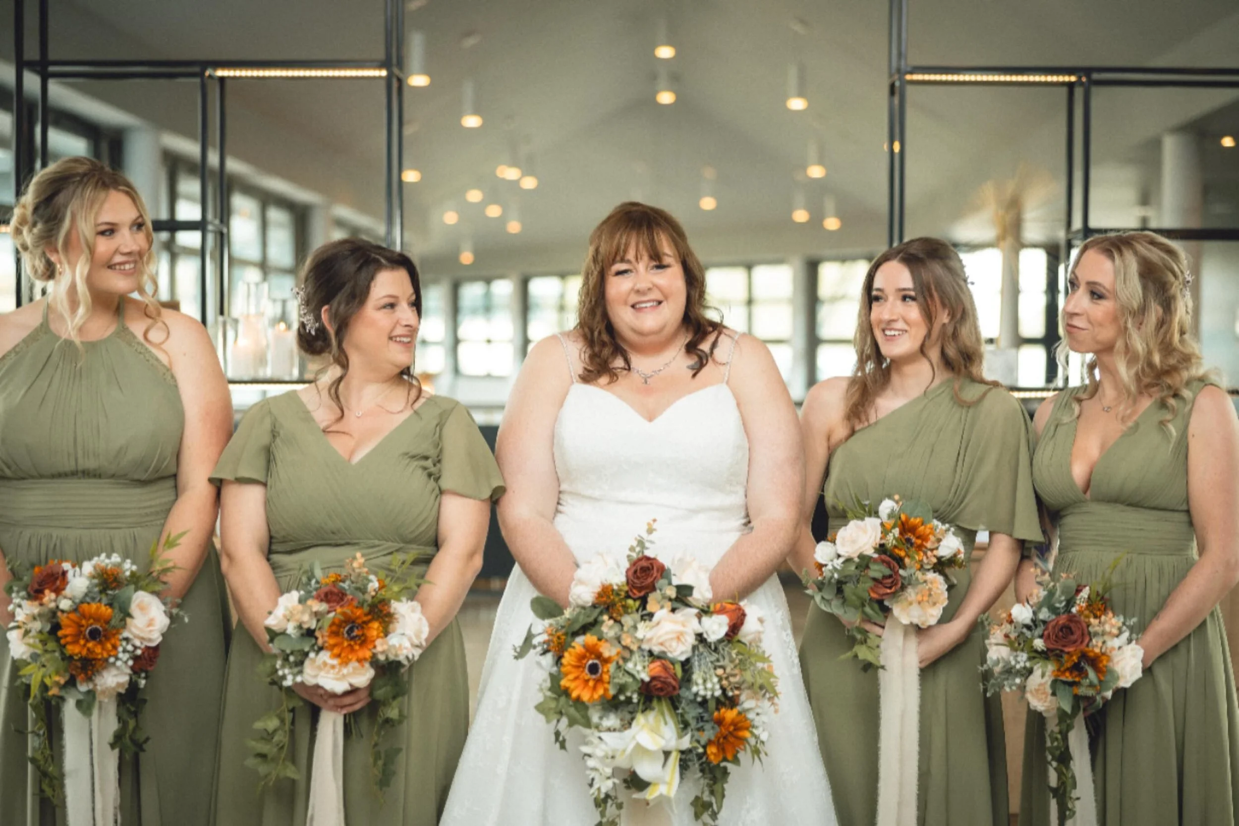 A moment for this bridal party 💛
Megan surrounded by her bridesmaids in soft sage dresses, with rich autumn florals adding warmth, texture and that cosy seasonal feel 🍂✨

Burnt oranges, peaches and calming greens came together so beautifully &mdash