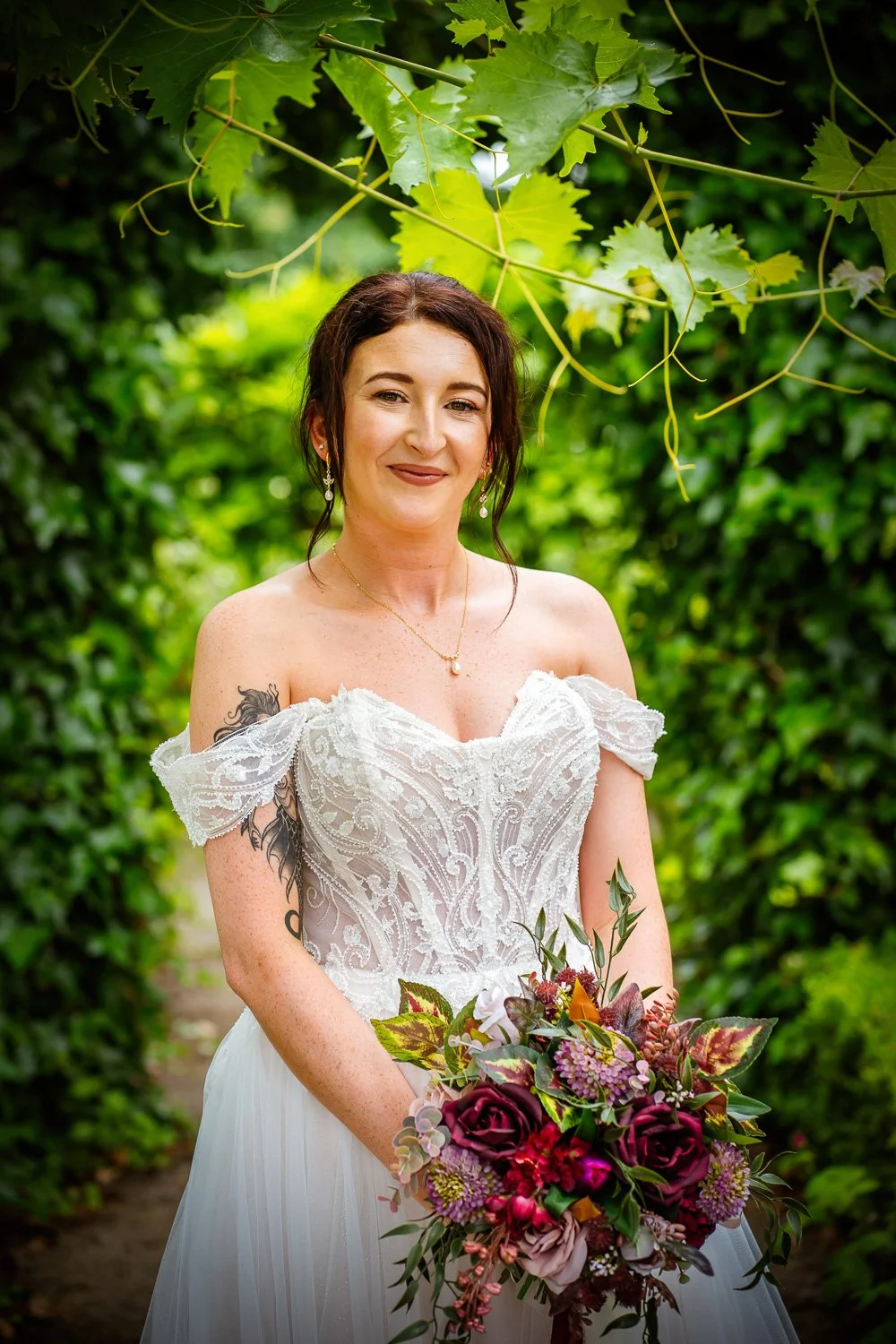 Romantic rustic wedding flowers in rich jewel tones for a Chester Zoo wedding.