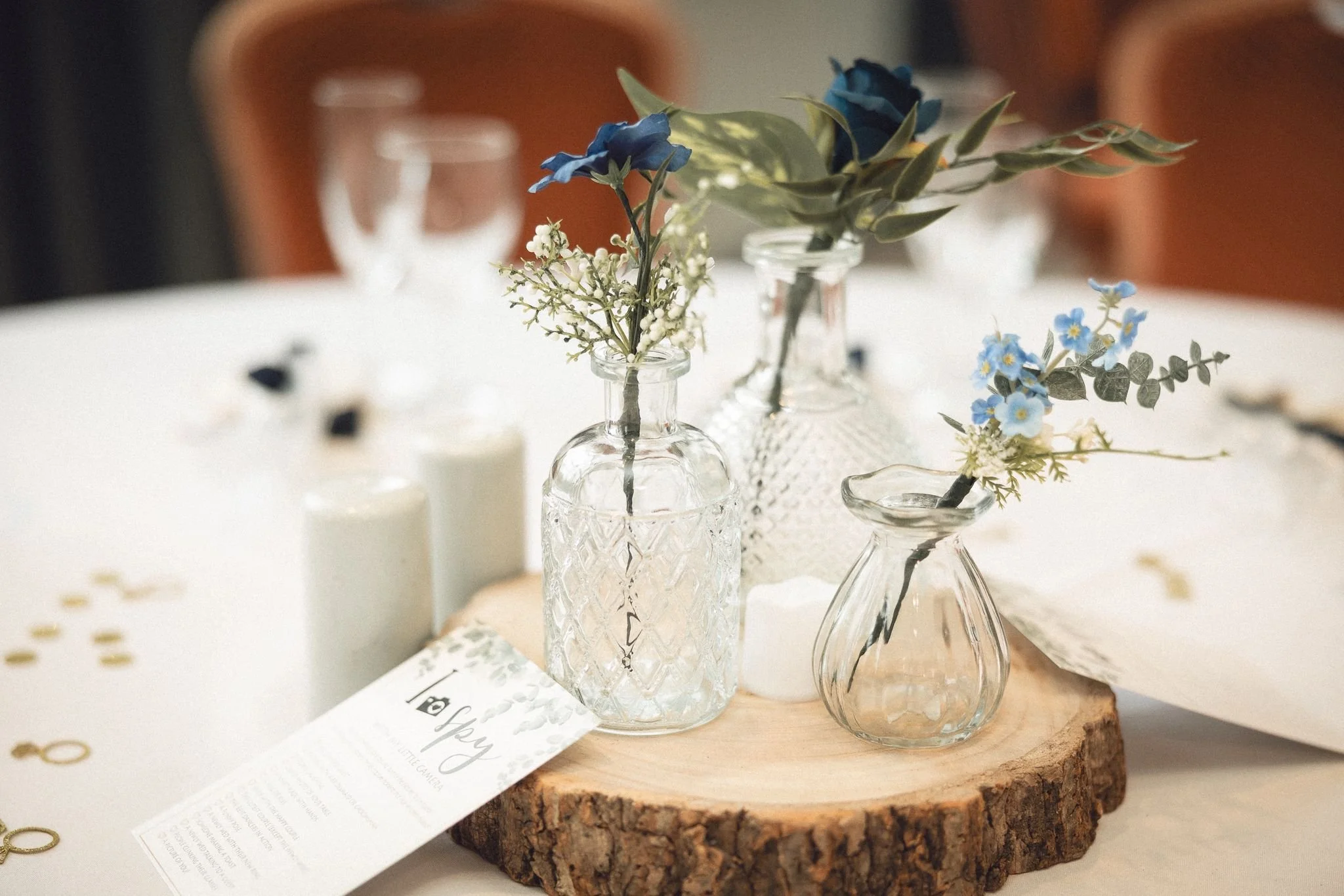 Centrepiece bud vases on a log slice