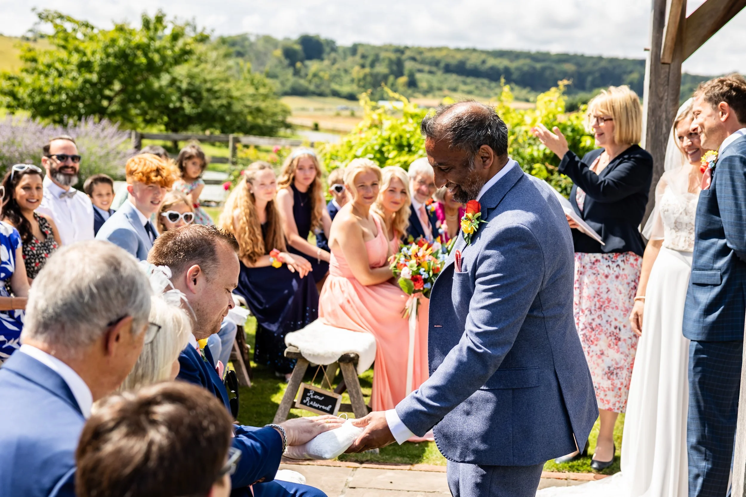 Wedding buttonhole with orchid and tropical foliage created for Anna and Christian’s Long Furlong Barn wedding.