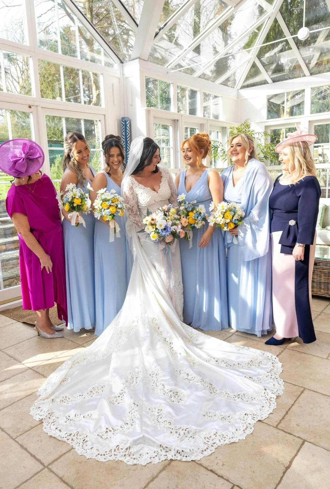 Bridesmaids wearing pastel wedding florals supplied by Petal & Twine, complementing the overall soft and romantic colour palette.