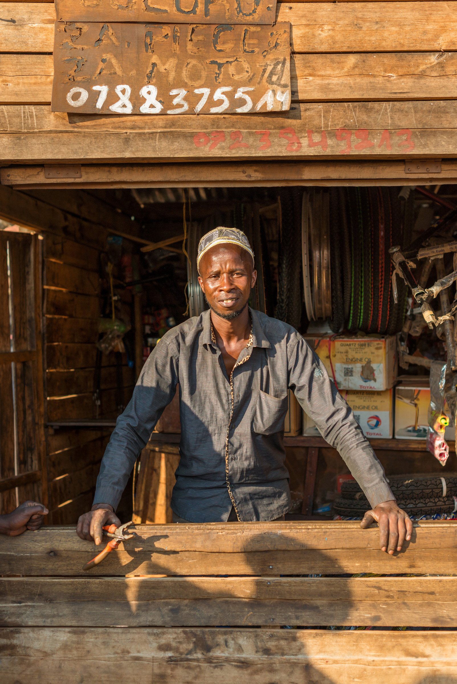 Bicycle repairman, village near Kigali -Bamberger