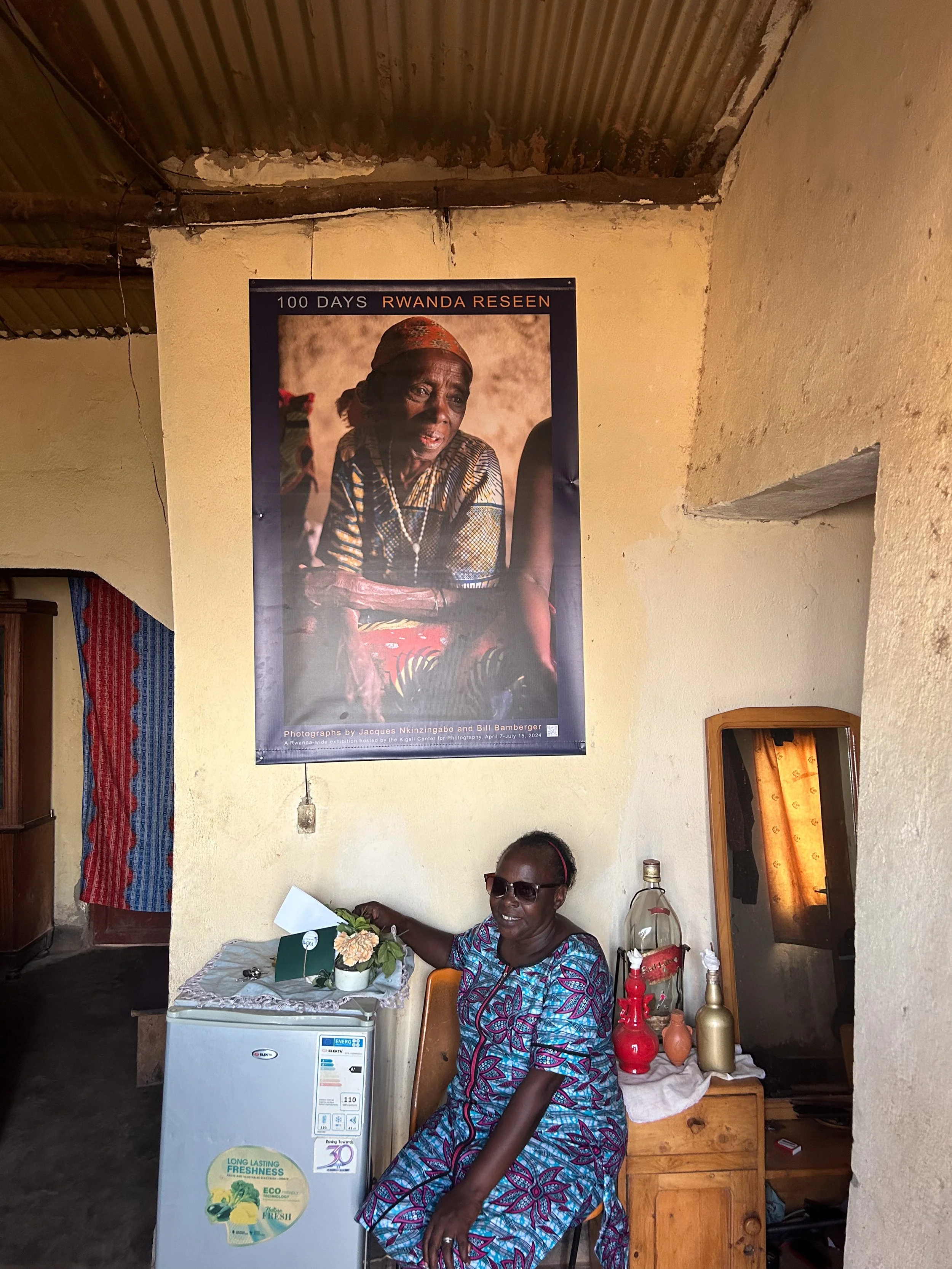 Terese in her Mt. Kigali, sitting below Bamberger's 2017 portrait of her mother.
