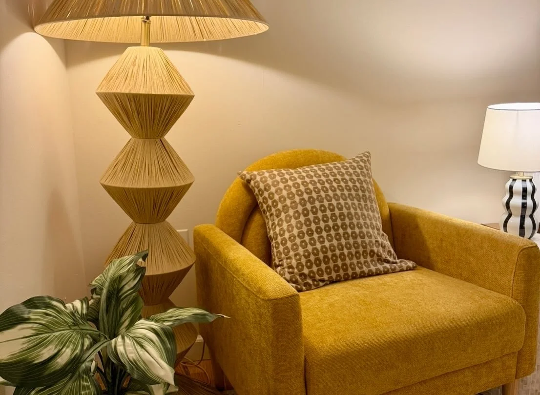 mustard yellow comfy chair with lamp and plant in nyc therapy office | gluck psychology collective