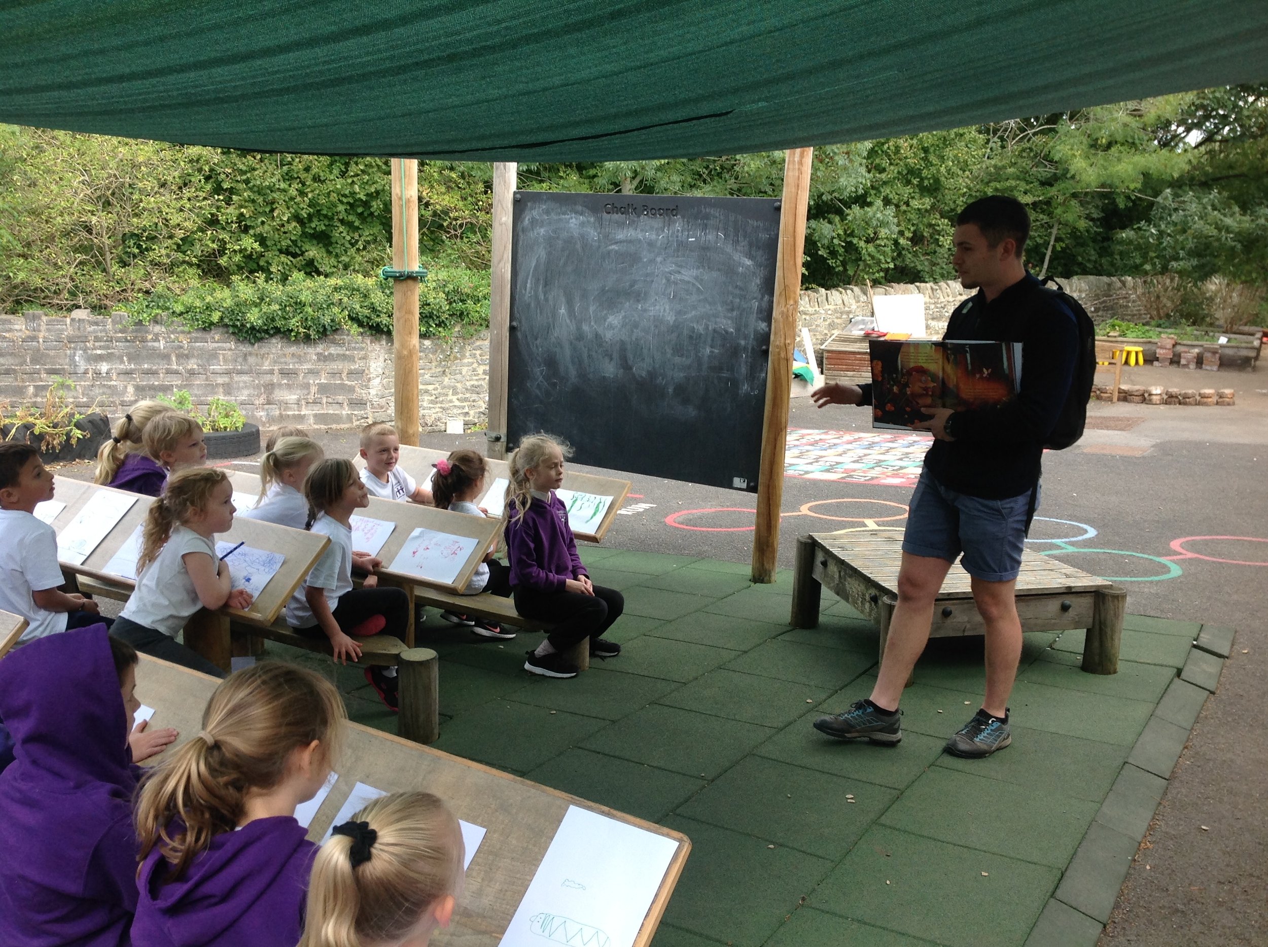 Pic 19 - School visit, outdoors, storytelling, pupils, benches.JPG