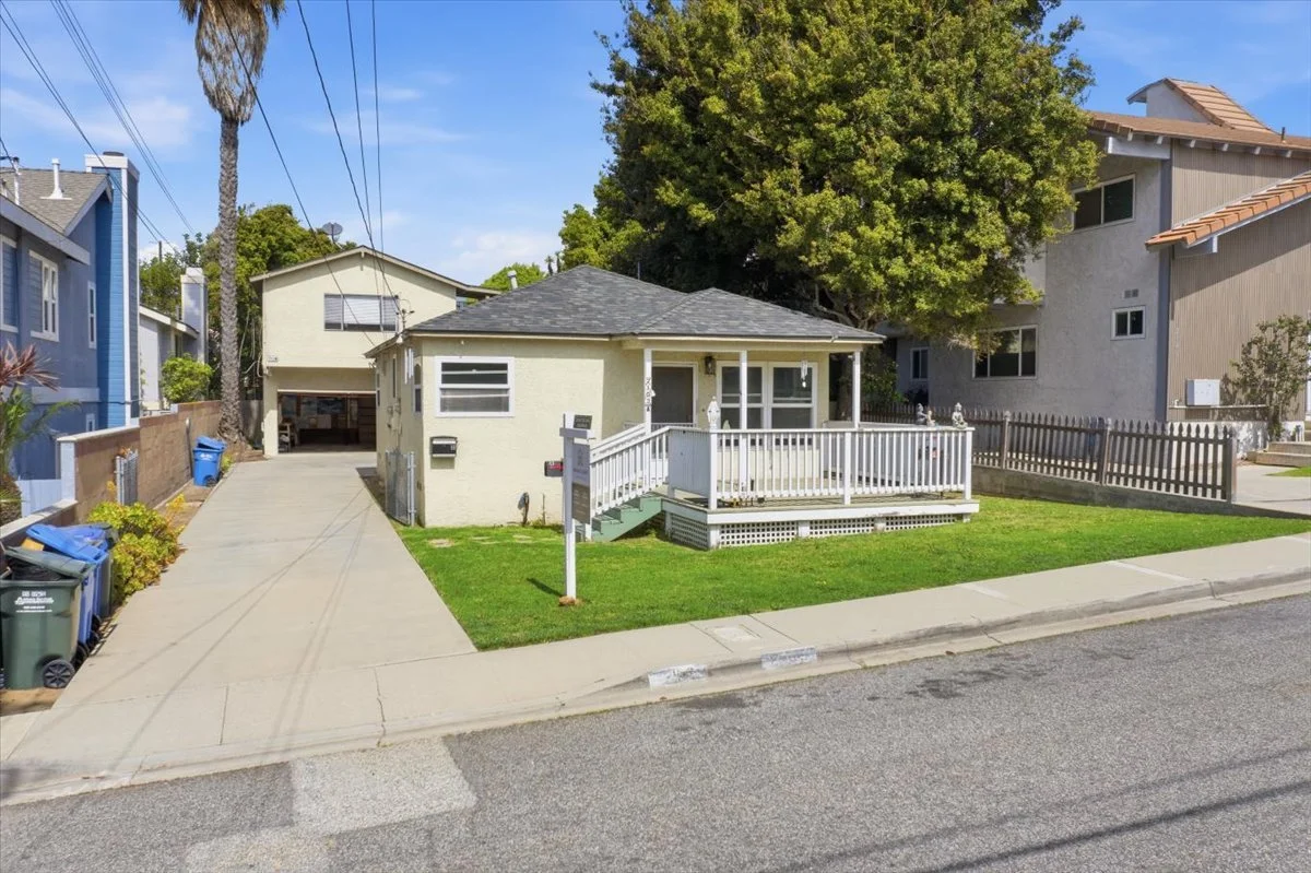 Beach cottage with white picket fence