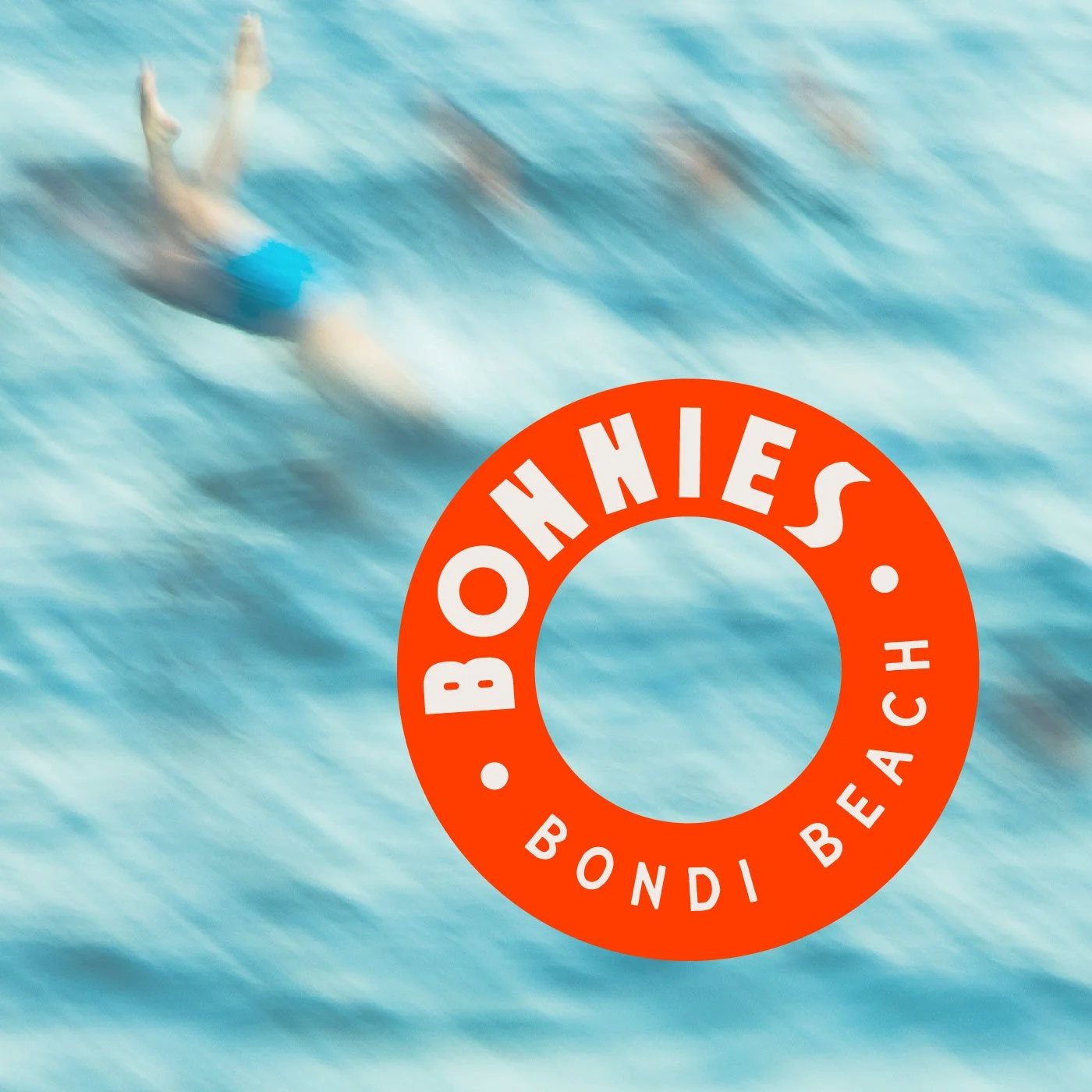 A motion-blurred swimmer dived into a blue ocean. A led ring logo overlays the images, text inside ring reads "BONNIES".