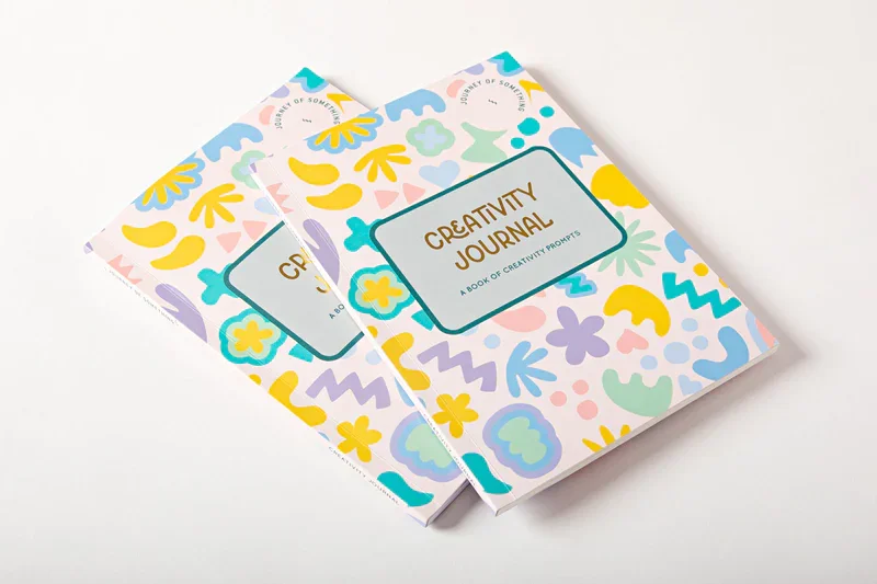 a bright creativity journal, with a pattern of bright, cheerful organic shapes on the surface