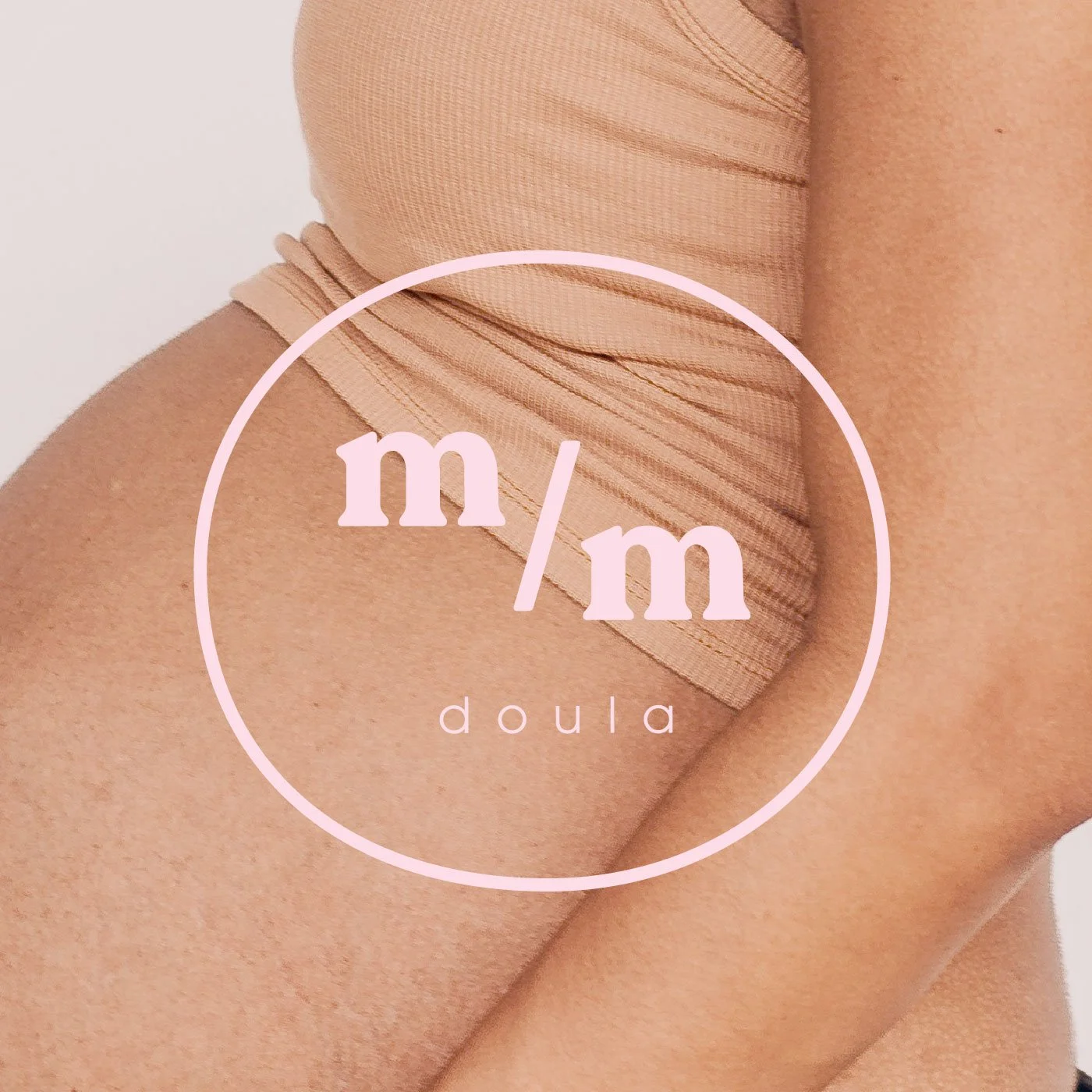 AA light pink logo for a doula business, layered over a close up image of a woman's pregnant belly