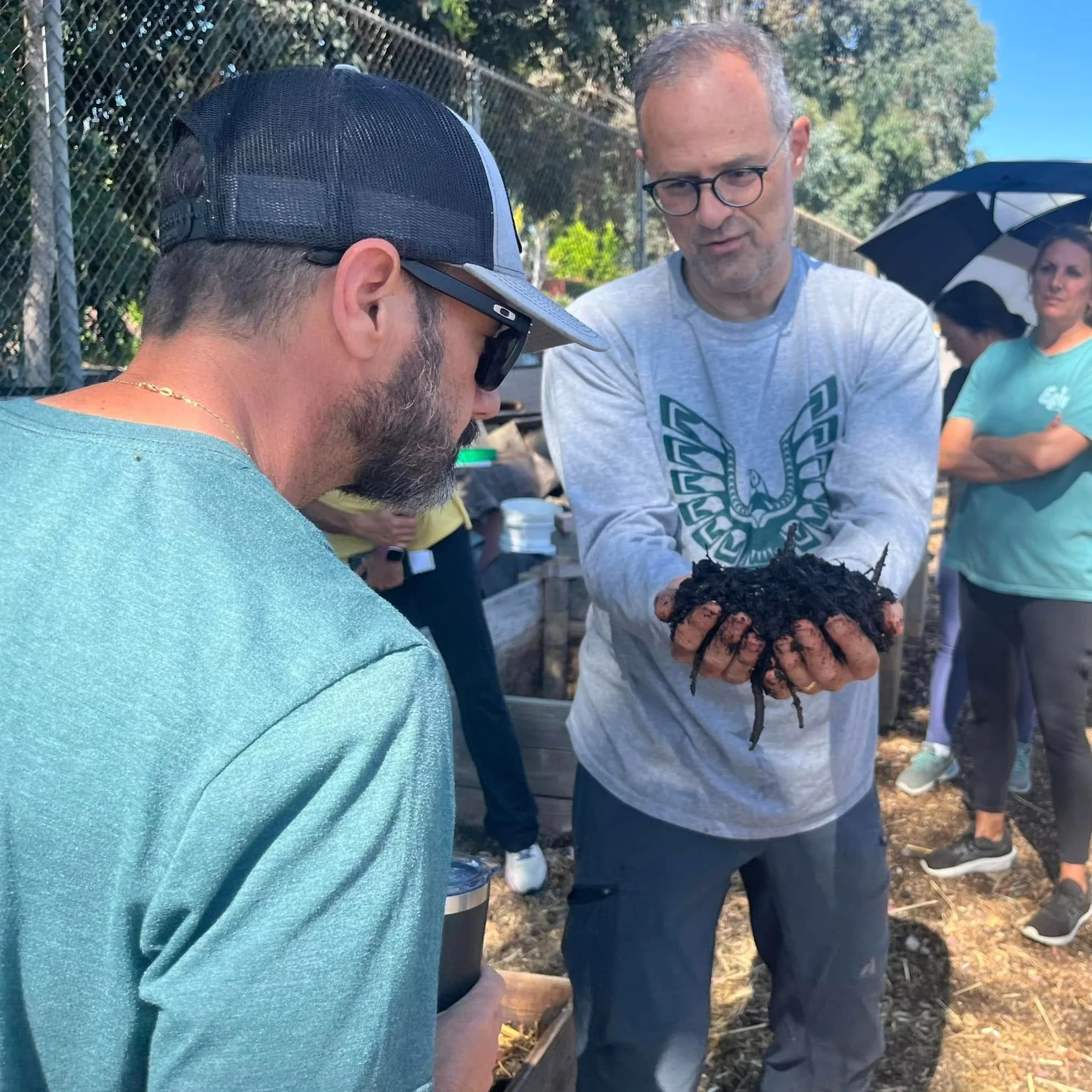 SCCG volunteer, Michael Land, teaching about benefits of using compost in your home garden.