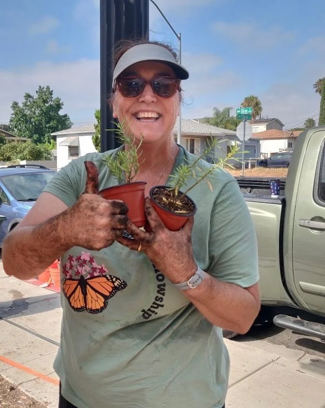 SCCG Board Member, Elena Banks, happily planting native seedlings.