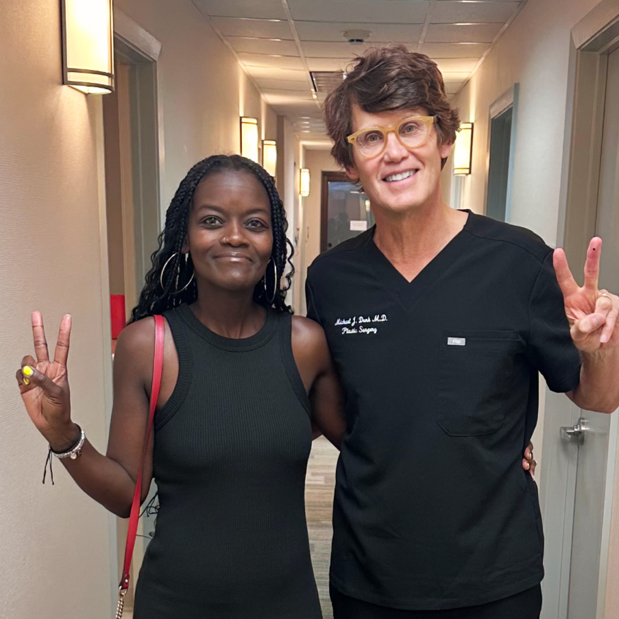 Dr. Michael Denk with a happy patient after plastic surgery in Virginia Beach, VA.