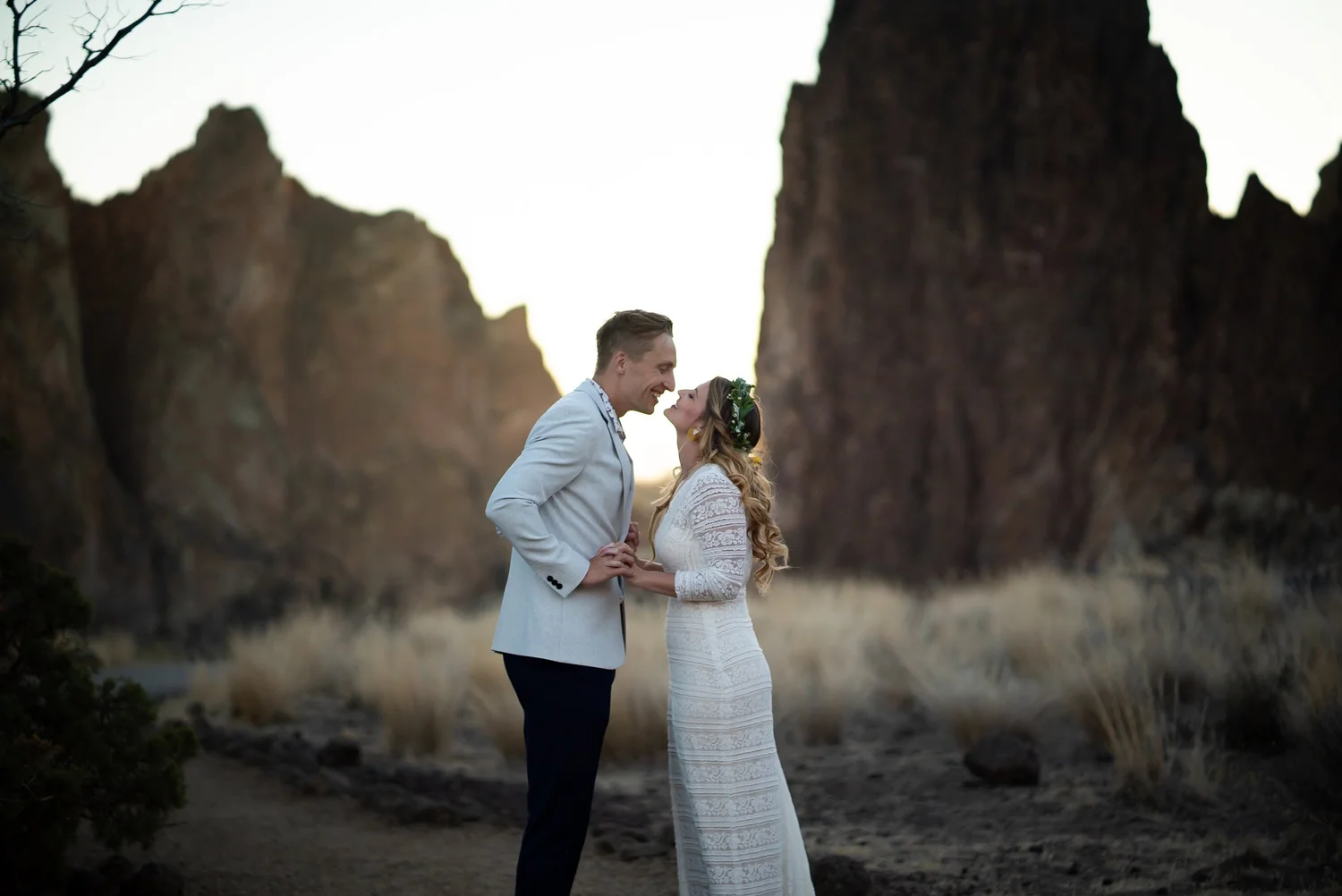 The Reeders facing each other among tall rock spires at dusk