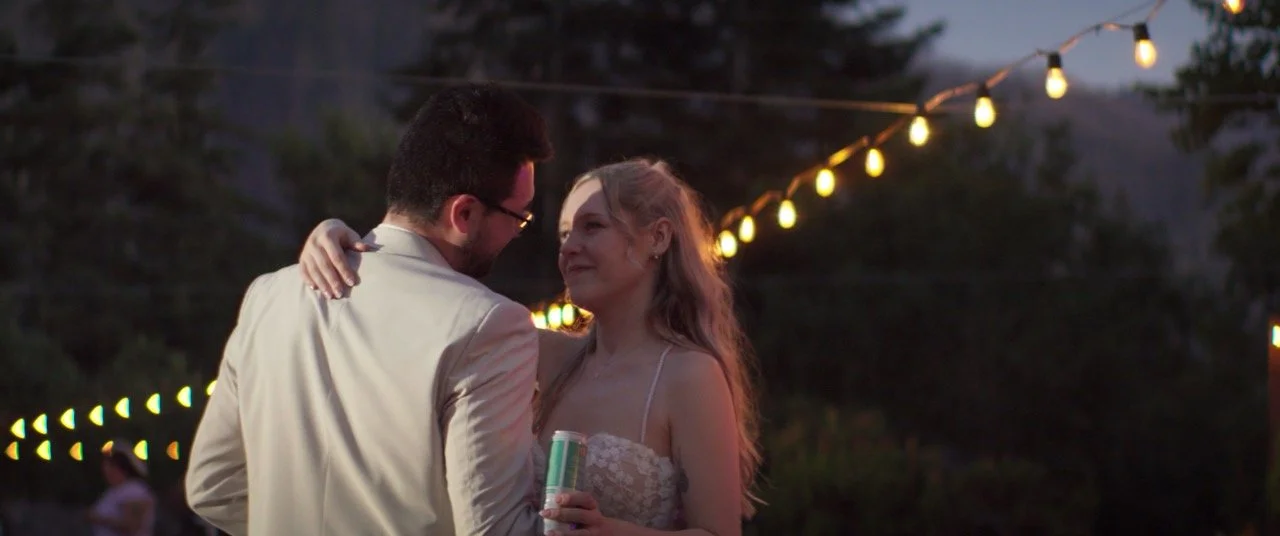 Quintin and Olivia under string lights at Cape Horn Estate