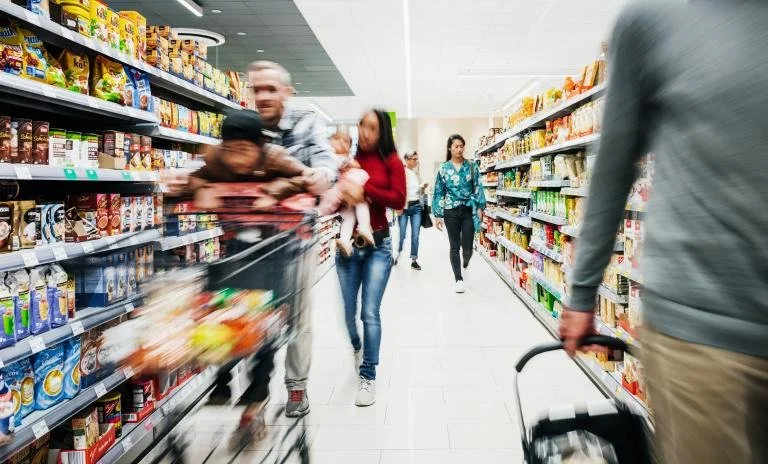 An image of people shopping in a supermarket