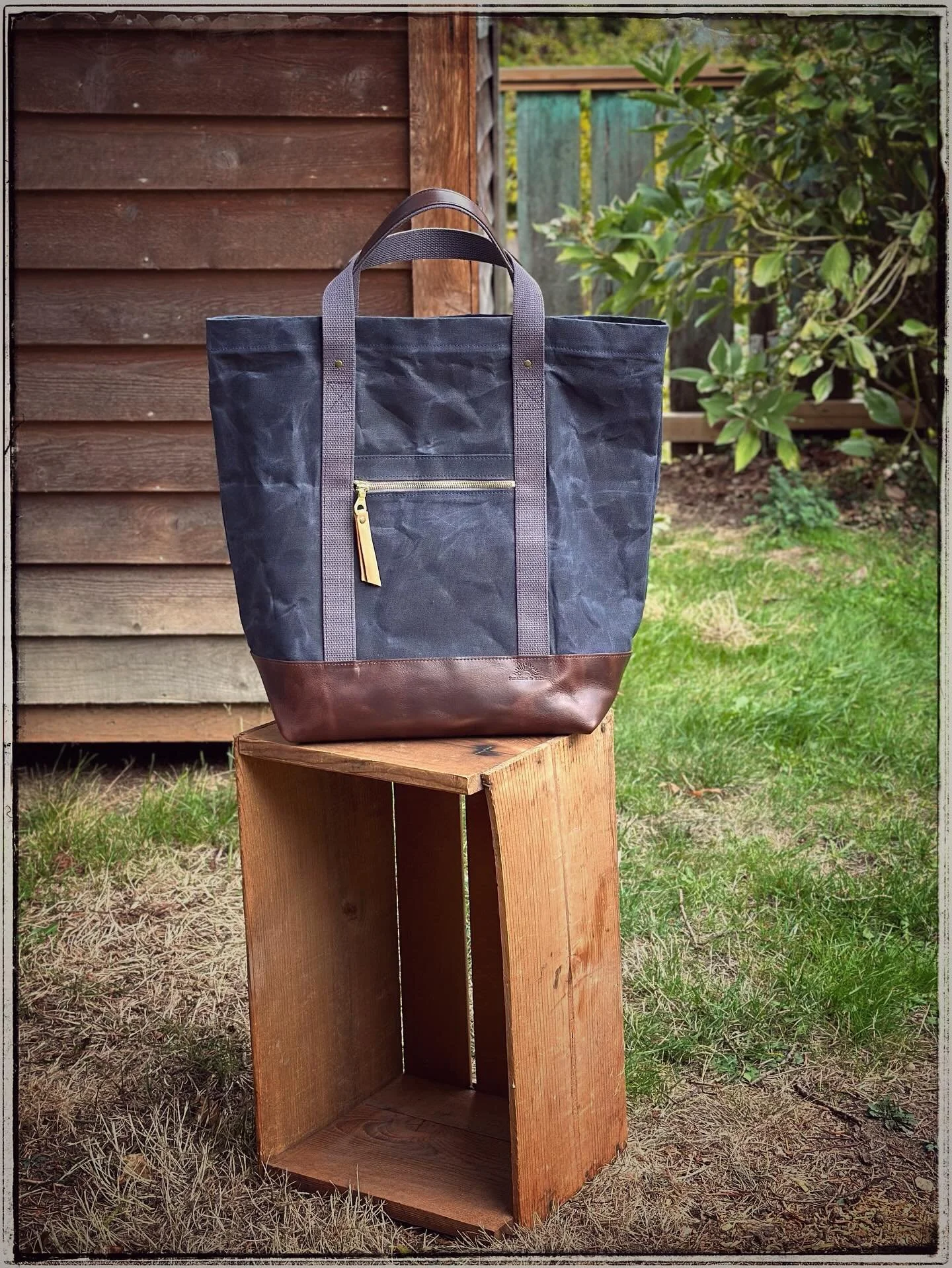 On a roll with another custom waxed canvas tote, this one in navy and Carolina brown chromexcel. 

I&rsquo;ve been using one of these extra large totes when I travel to my art shows and keep it stashed with all the extra stuff I may need to have in a