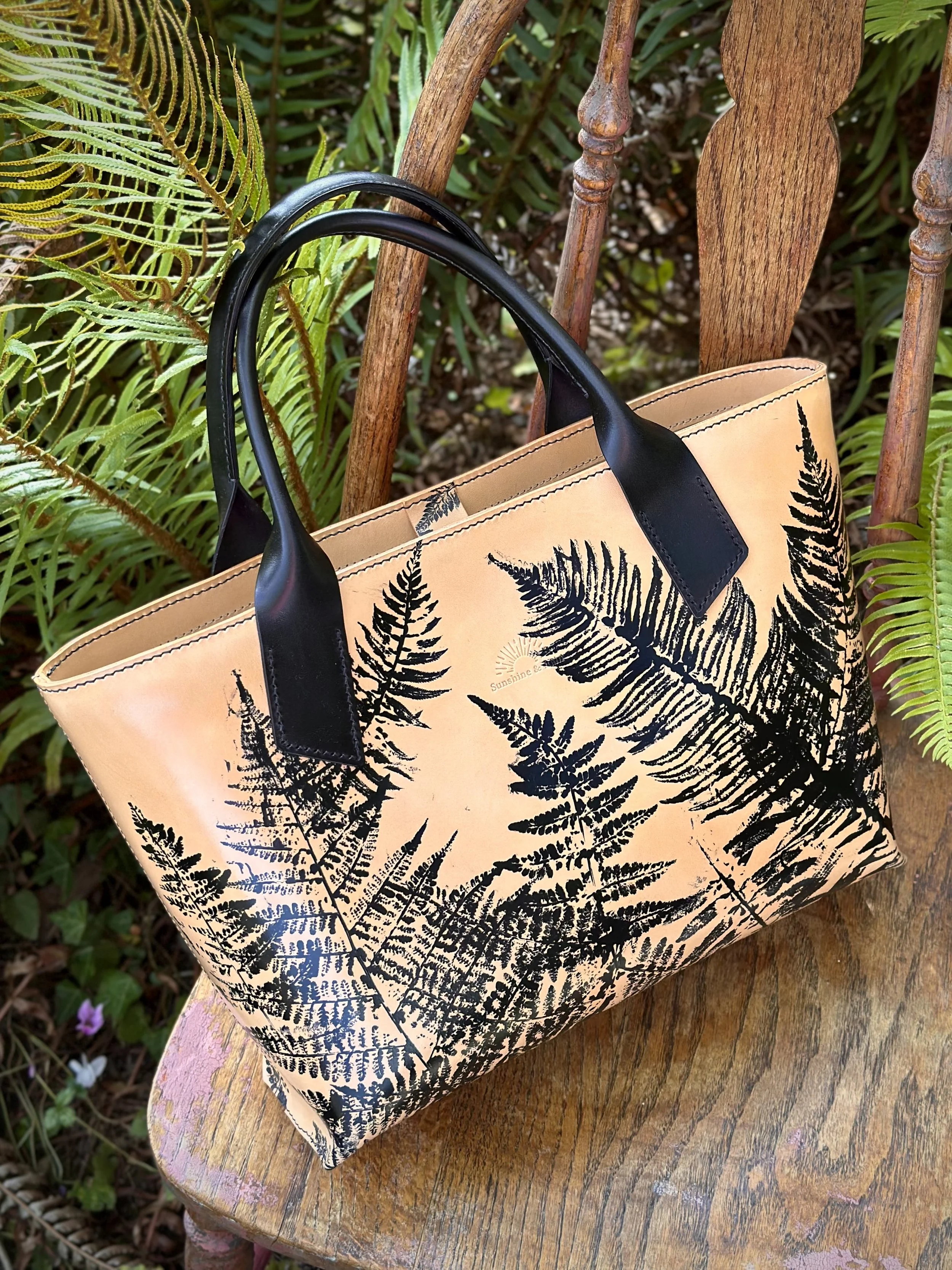 fernbagangledleaningoutsidegarden.jpg