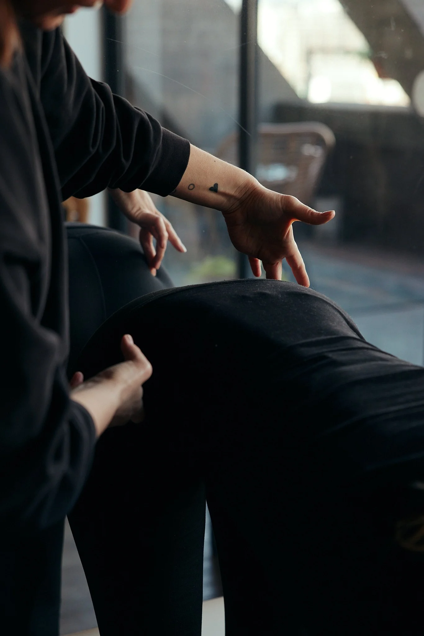 Physiotherapist assessing movement and body control during a hypermobility physiotherapy session