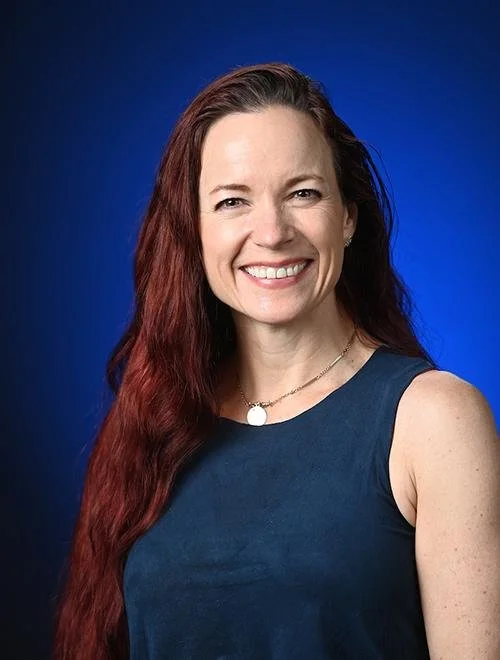 Beth Ann Fennelly headshot against a blue background