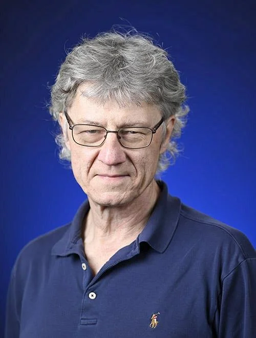 Luca Bombelli headshot against a blue background