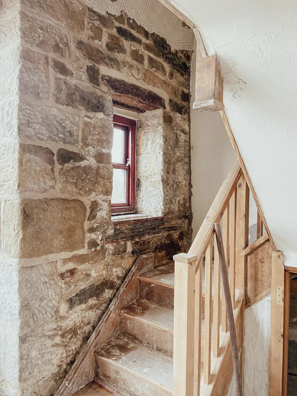 Stone quoins exposed, cleaned, and repointed