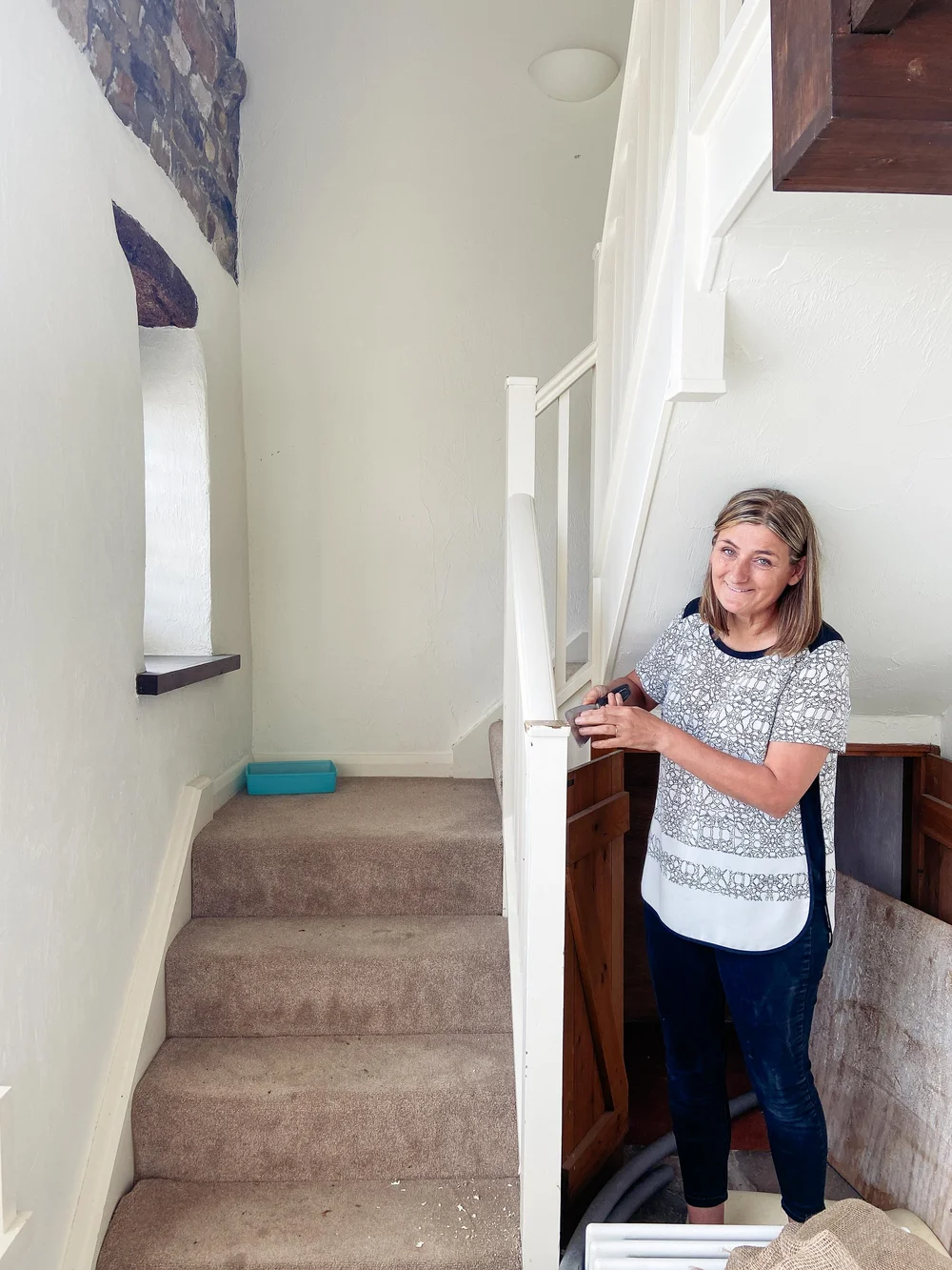 Mum making a start on stripping the staircase