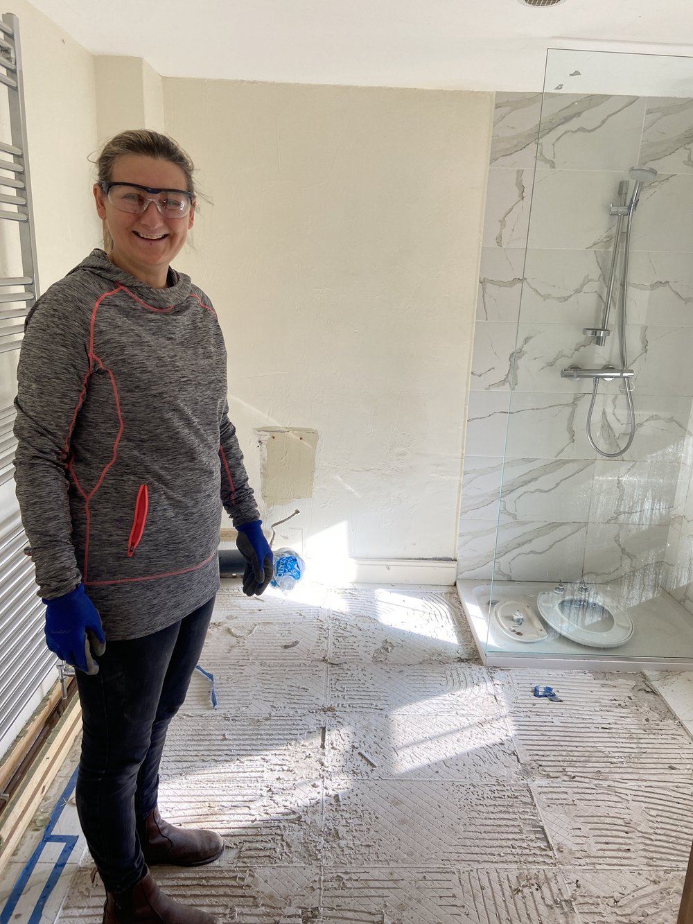 Mum removing the floor tiles!