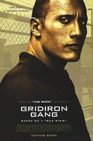 Gridiron Gang poster with The Rock staring at us