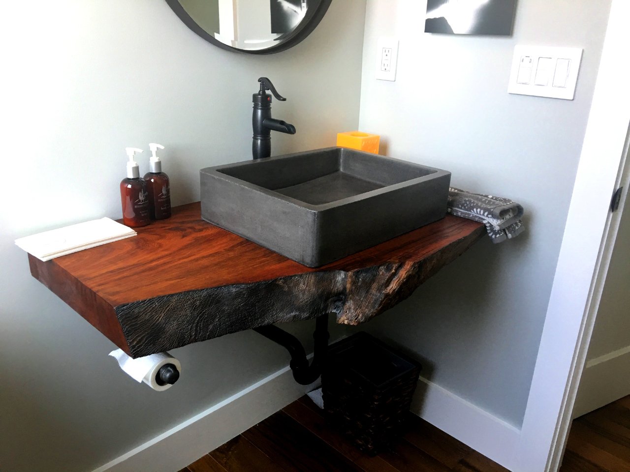 Live edge bathroom counter made from a piece of redwood salvaged from an old stump.