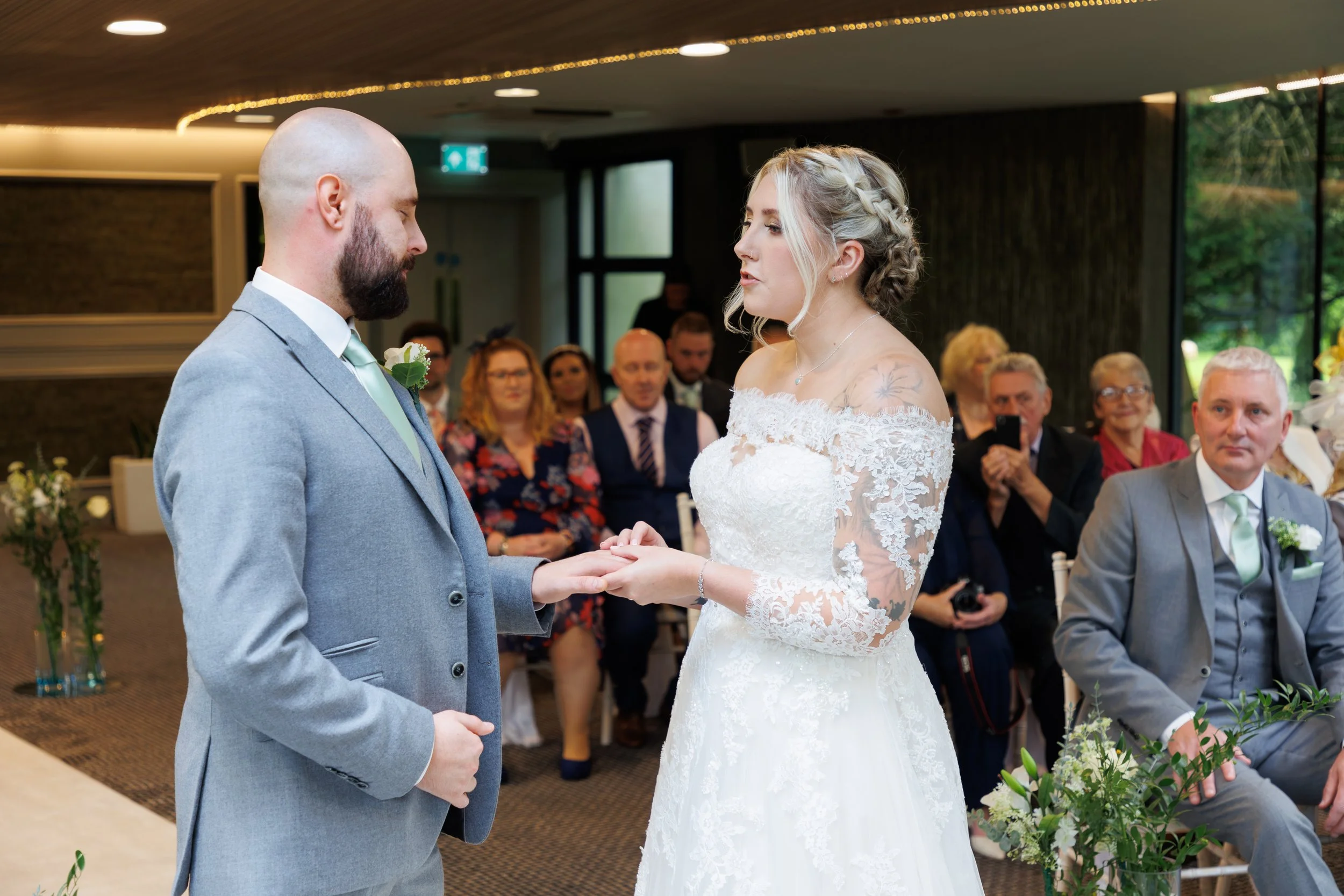 Exchanging of rings at Fairyhill K room Wedding photography by Andrew L Price