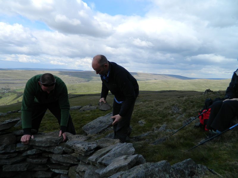 Great Whernside - just could resist patching up a little shelter, even out on a walk (Molly Pridmore)