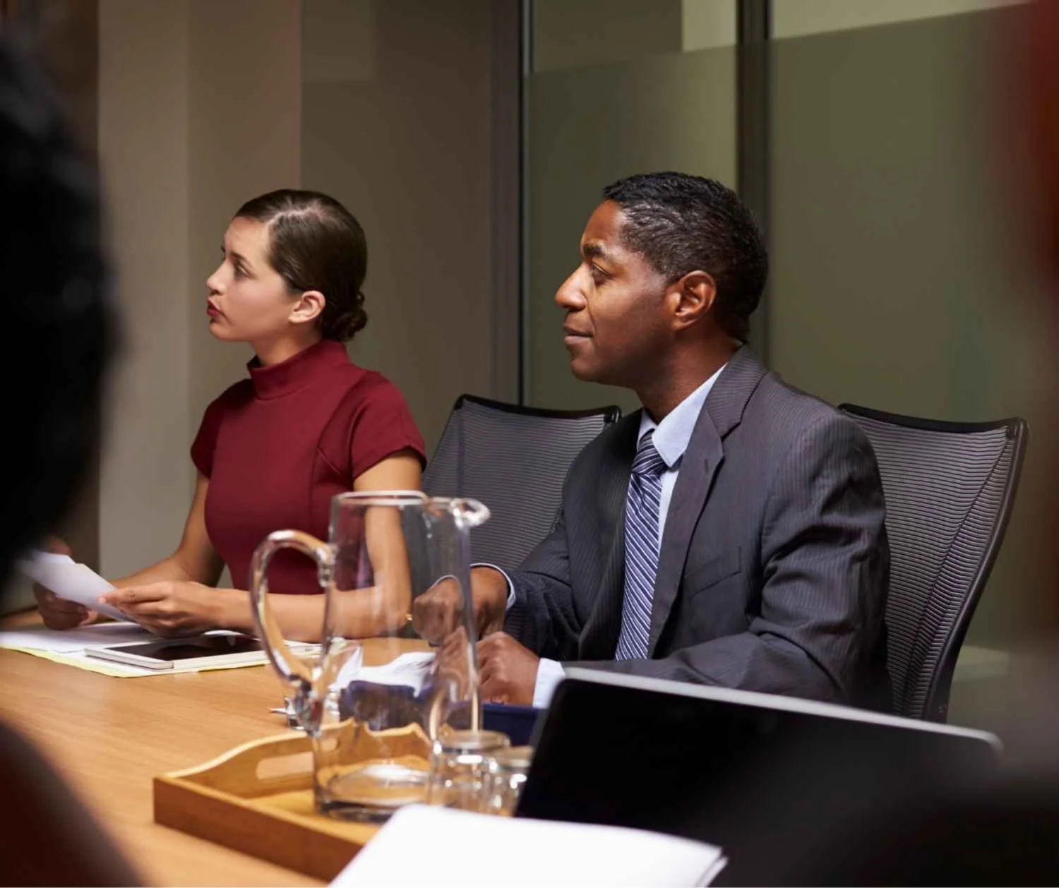 Man listening carefully during a small work meeting