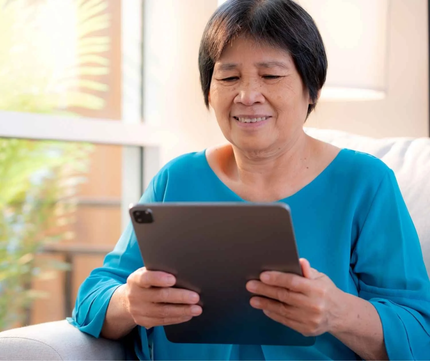 Adult using a tablet communication app